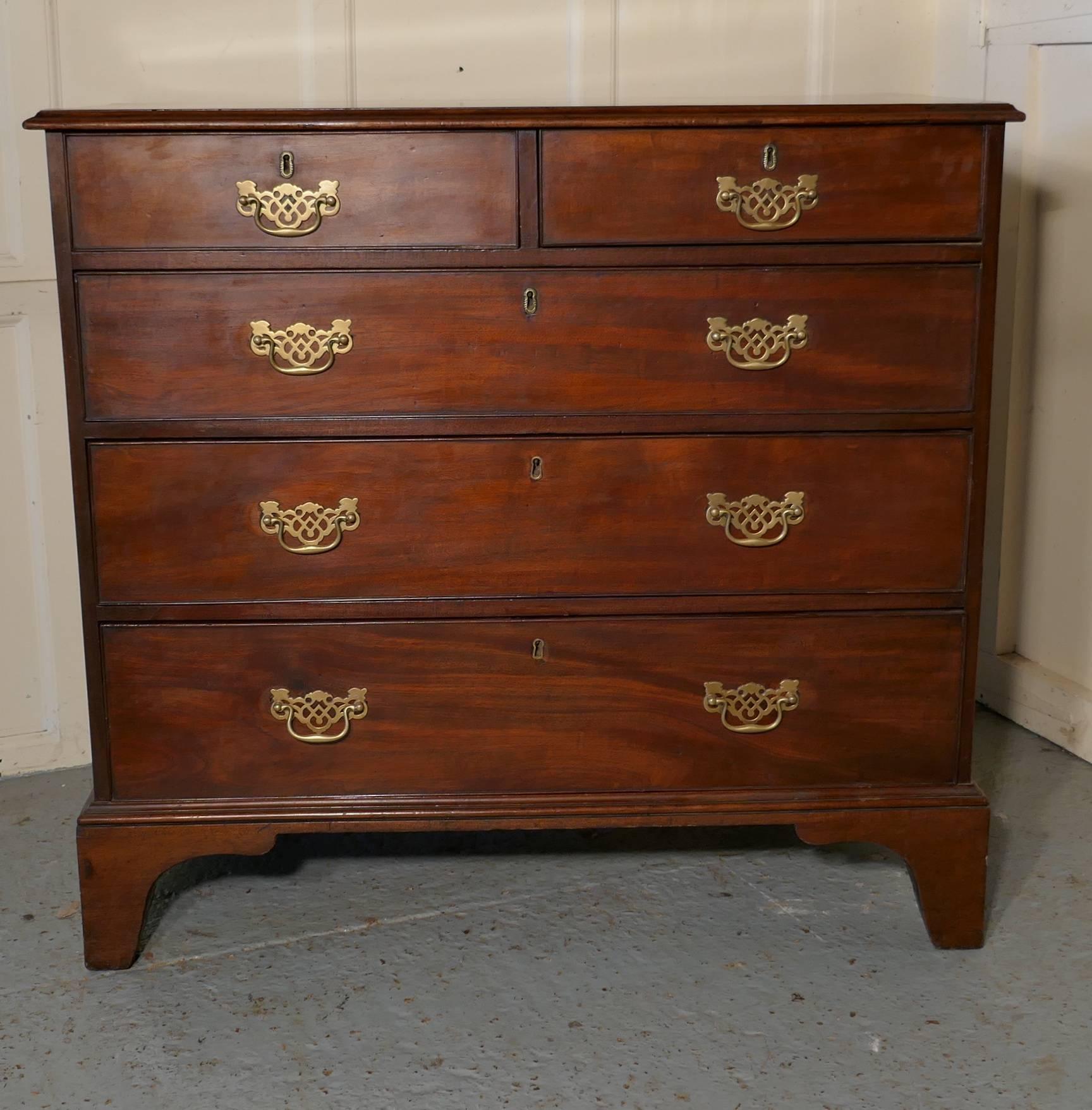 Georgian mahogany chest of drawers.

This chest has a good natural patina, the chest has two short drawers at the top and three graduated long drawers beneath, these are set off with brass escutcheons and matching pierced swan neck handles, and it