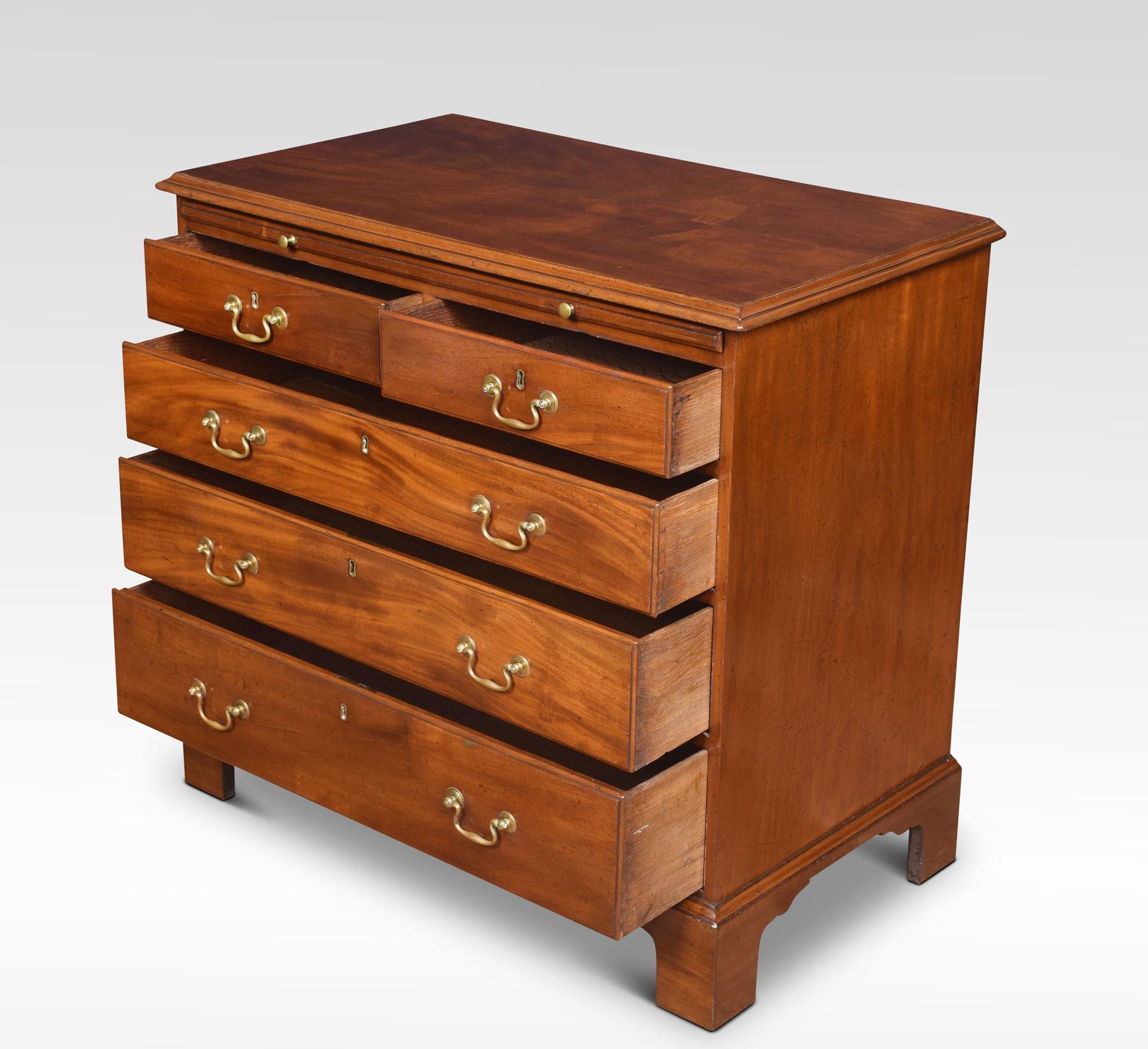 Georgian chest of draws the rectangular well figured top over brushing slide and two short and three long graduated drawers with original brass swan neck handles all raised up on bracket feet.
Dimensions:
Height 33.5 inches
Width 35.5