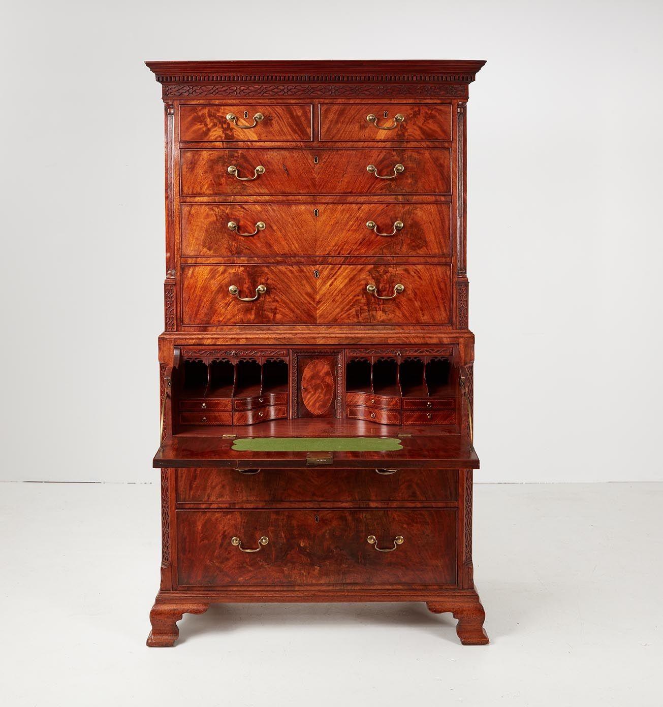 A very fine Georgian chest on chest in figured bookmatched flame mahogany having two short over four long drawers in top section and three drawers in the lower section, with the top drawer of the lower section opening via machined brass arch hinges