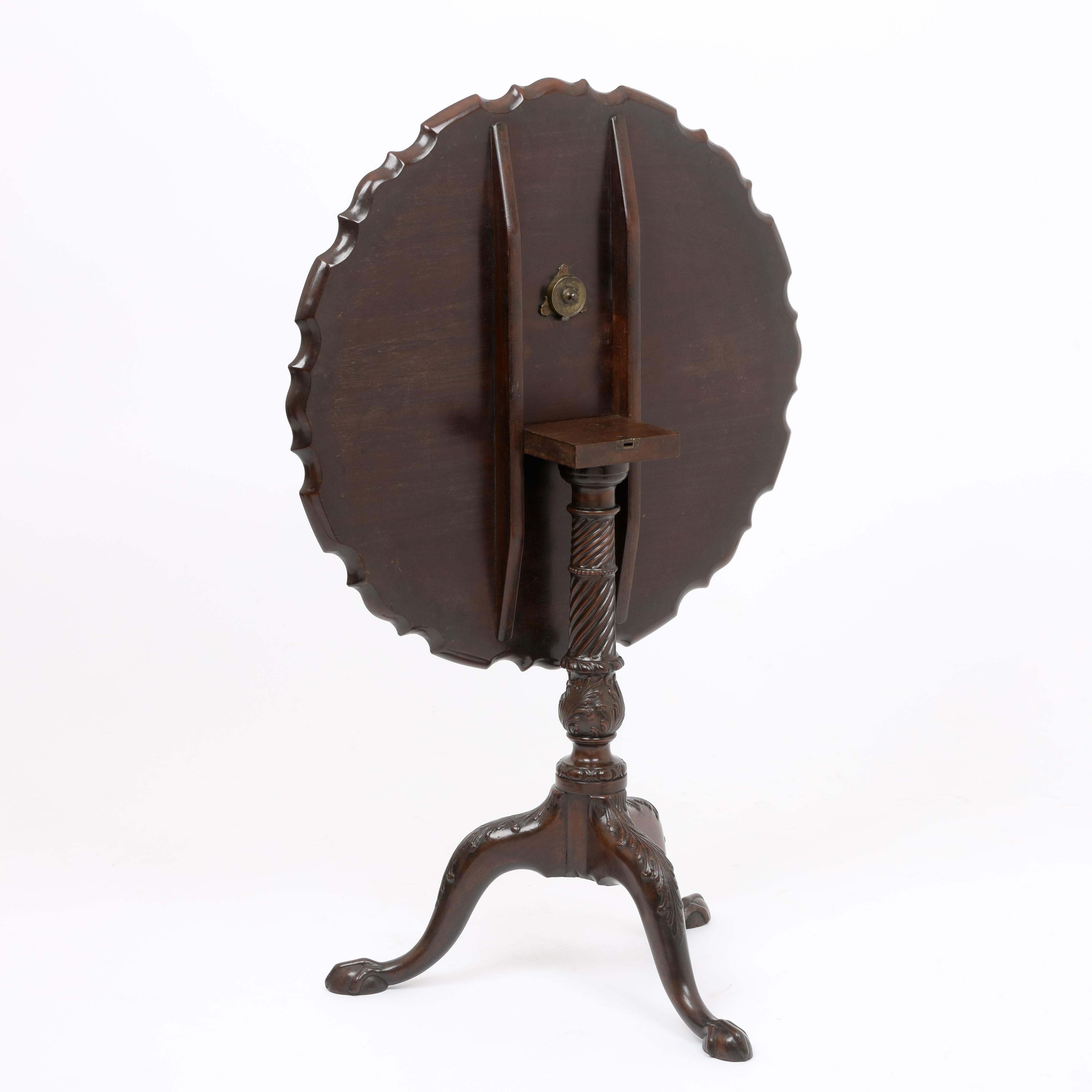 An exceptional early George III period figured mahogany circular tripod table with profusely carved legs and stem and piecrust edged top.
This outstanding table is in fine original condition and illustrates one of the best carved bases I have seen