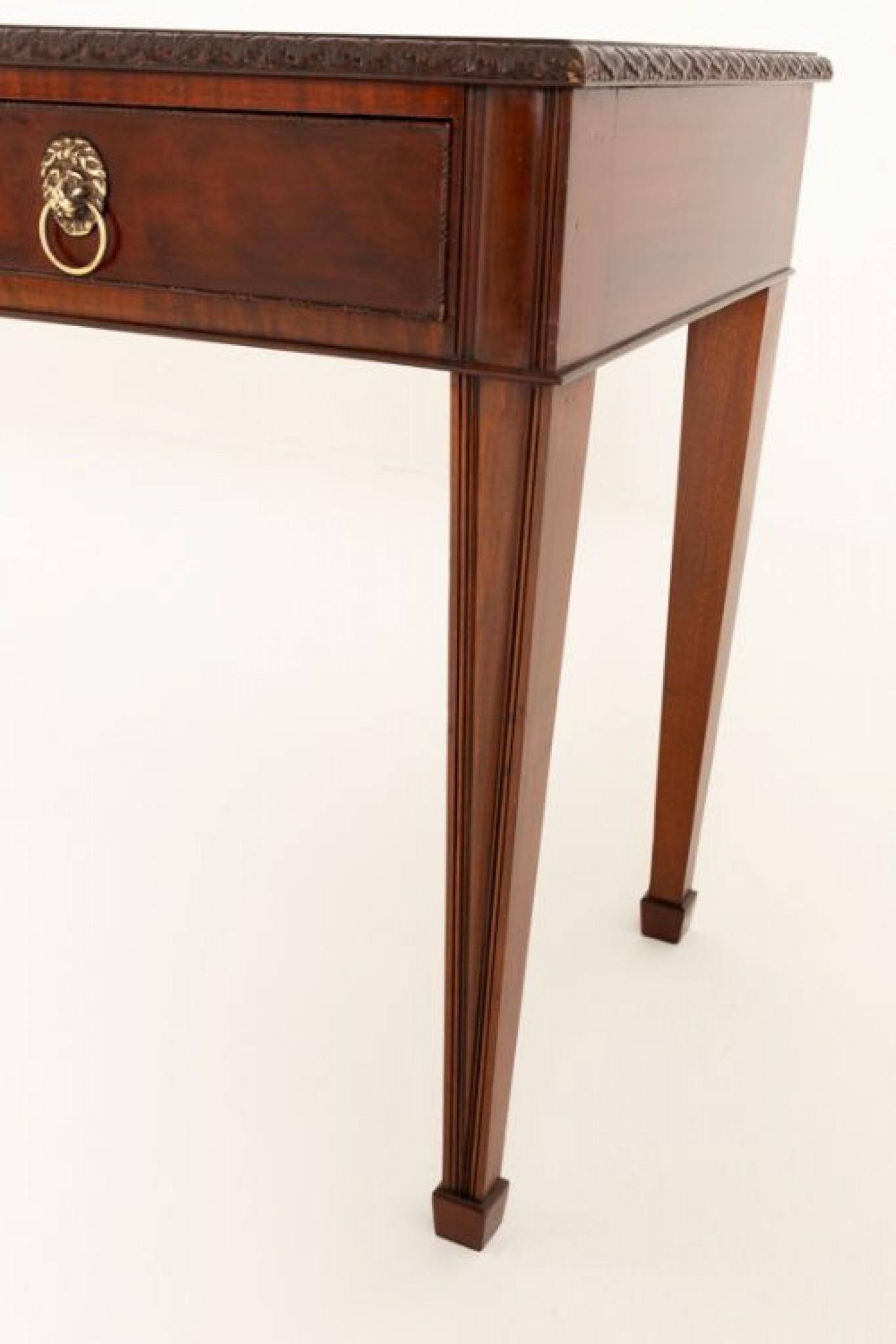 Georgian Revival Mahogany Breakfront Serving Table.
Circa 1880
This Impressive Serving Table is Raised Upon Elegant Tapered and Fluted Legs with Spade Feet.
The Table Features 3 Oak Lined Drawers With Brass Lions Head Ring Pull Handles.
The Drawers