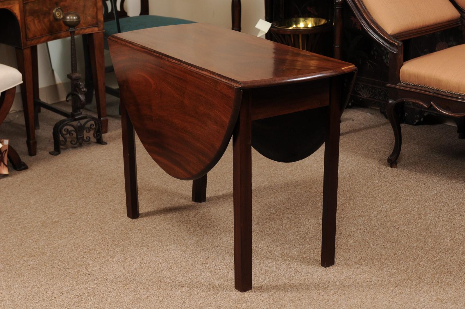 Mid-19th Century English Georgian drop leaf table in mahogany with square legs.