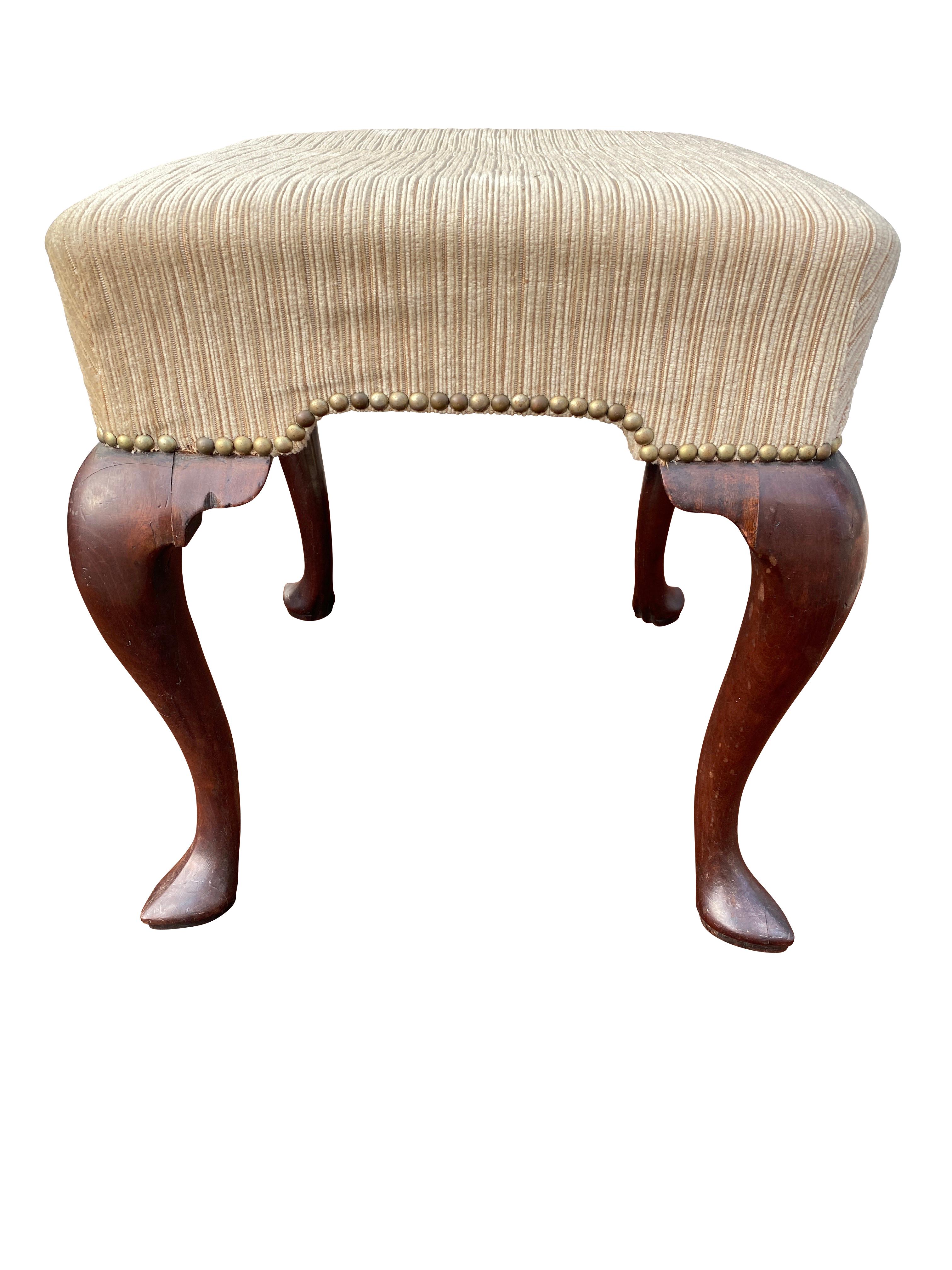 Square beige mohair seat raised on cabriole legs with pointed pad feet.