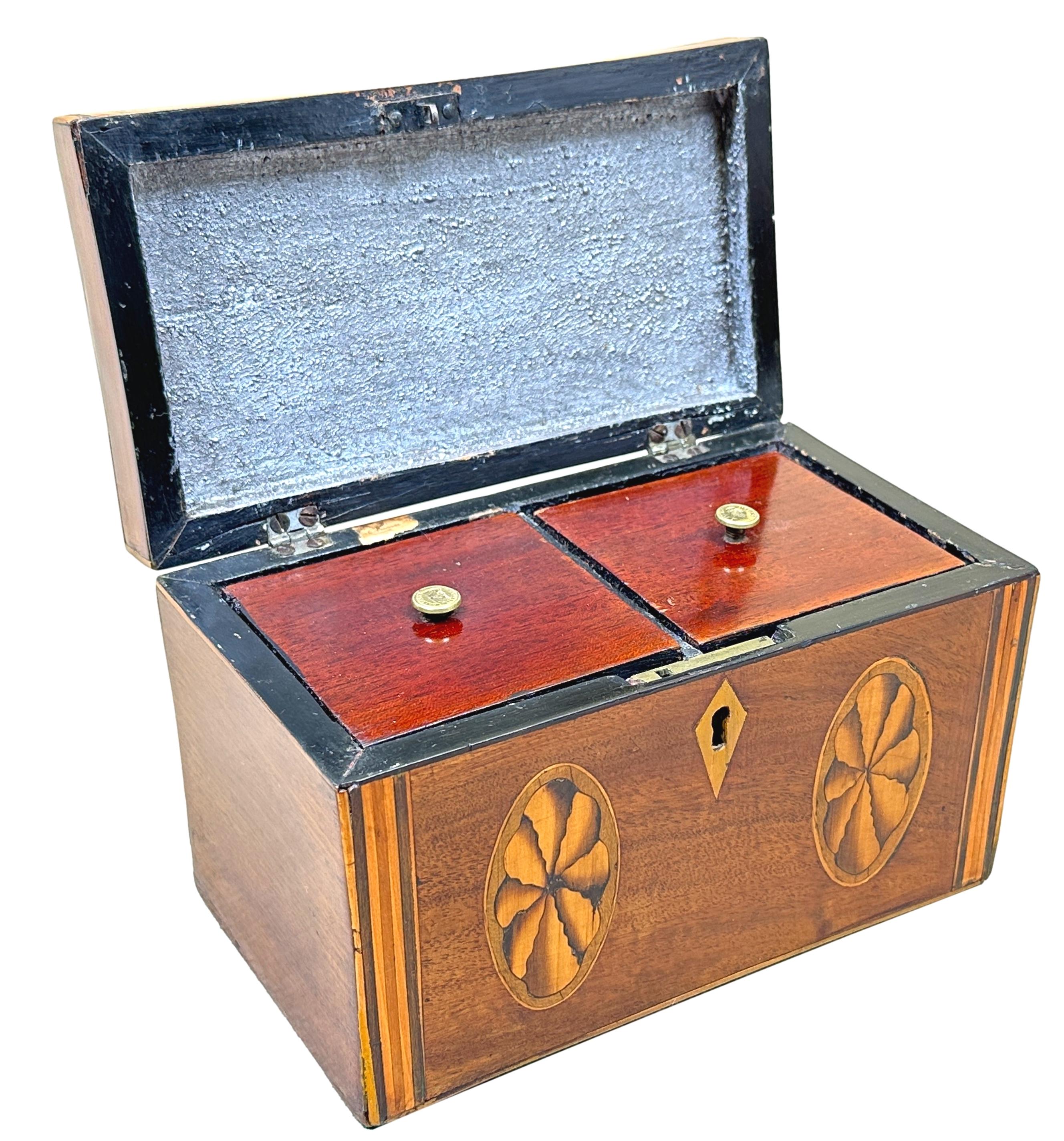 A very attractive and good quality late 18th century Georgian mahogany oblong tea caddy, retaining good colour and patina, having attractive inlaid decoration to front and hinged lid, enclosing double sectioned interior with lids.


Tea was a