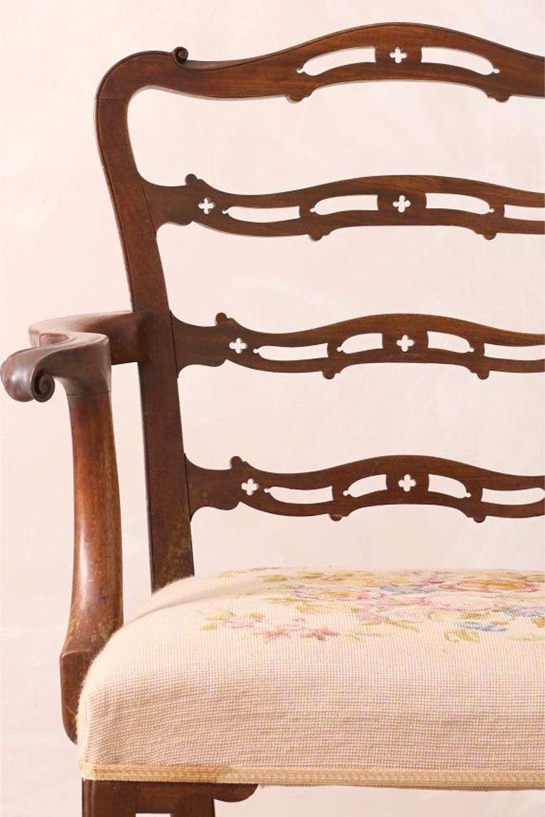 This is a very high quality solid mahogany Georgian period ladder back armchair. It has a huge amount of detail in the back and great amount of shape to the arms. Standing on a stylish frame making it both a great chair to look at as well as use. It