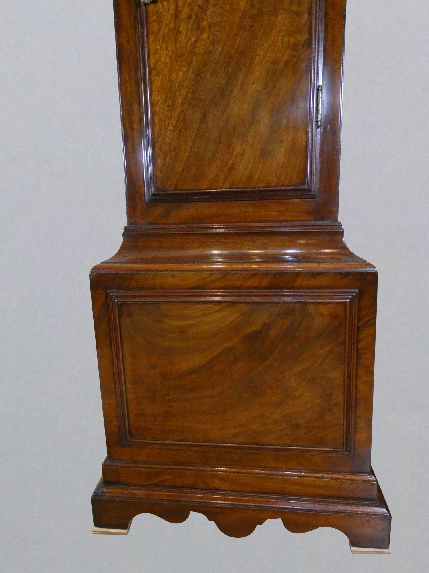 Georgian Longcase clock by John Taylor, London
 
 
Finely figured flame mahogany case with stepped shaped plinth and inset panel to the base. Long break arch top trunk door with raised moulding and brass escutcheon. Break arch hood with