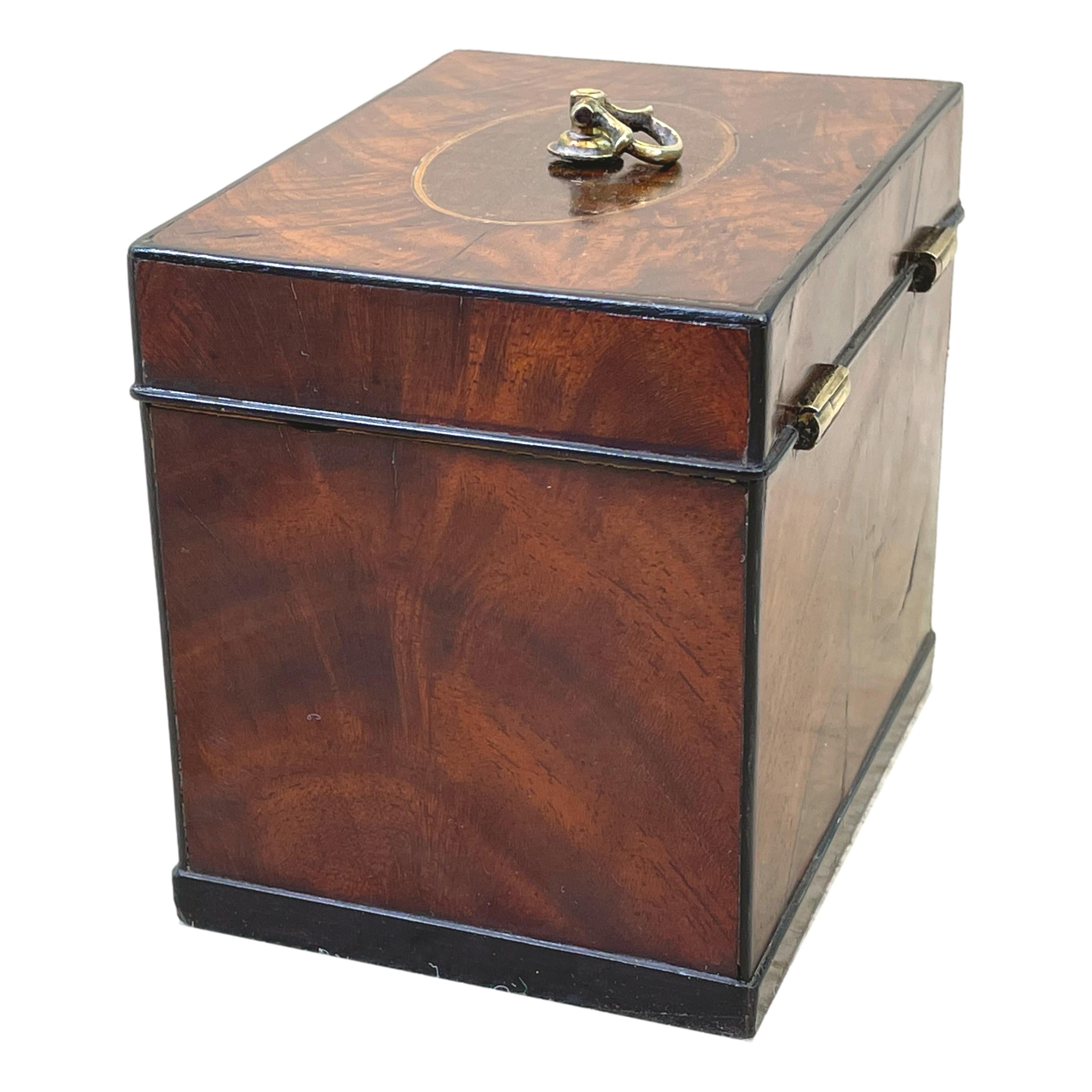 A Good Quality 18th Century Georgian Mahogany
Oblong Tea Caddy Having Well Figured & Inlaid 
Hinged Lid Enclosing Original Paper Lined Interior
With Original Solid Lead Lid

(Tea was a very precious commodity in the 18th century and
tea