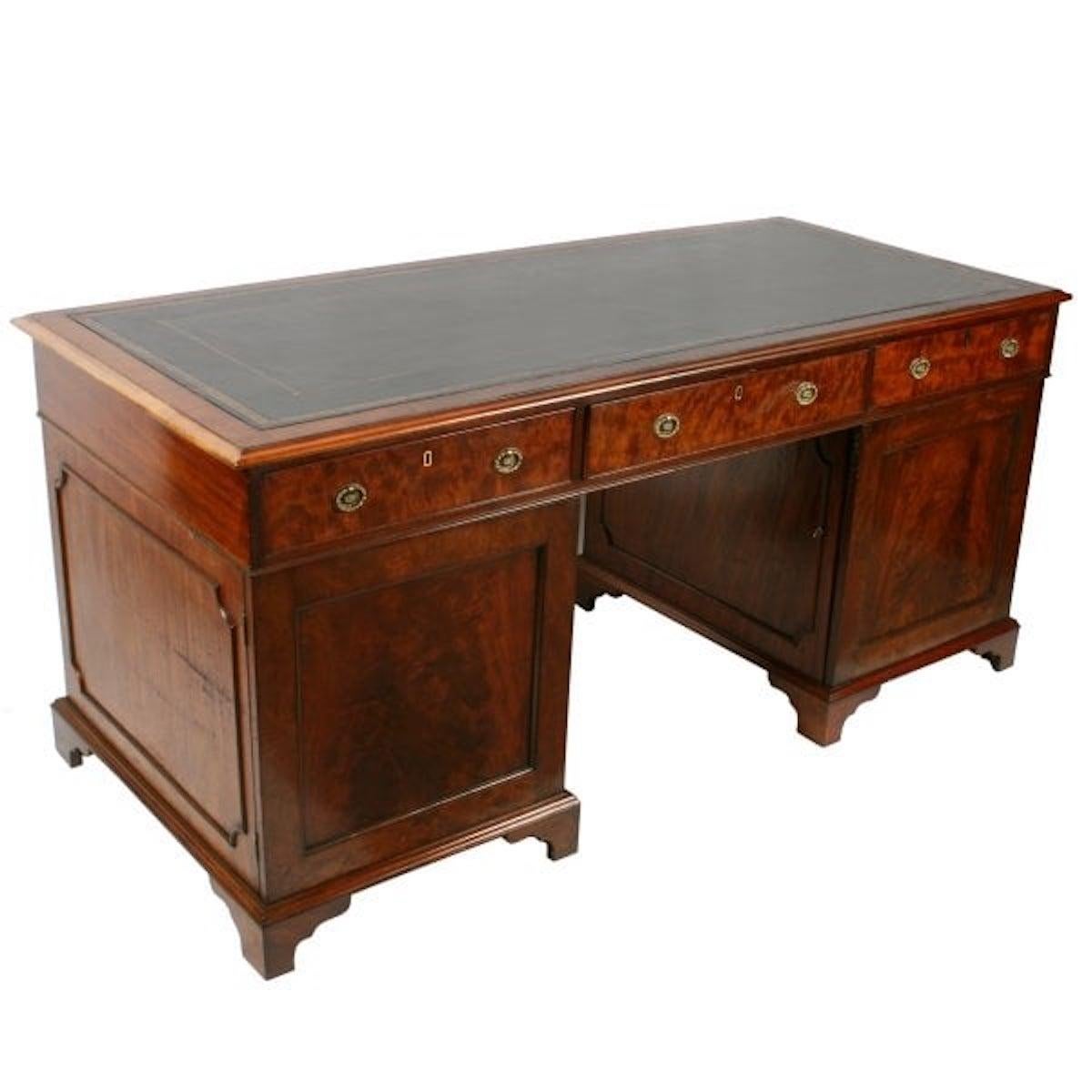 Georgian Mahogany pedestal desk

An 18th century Georgian mahogany pedestal desk.

The desk has a gold tooled black leather writing surface, three drawers across the front and two cupboards.

The left hand cupboard has four drawers inside and