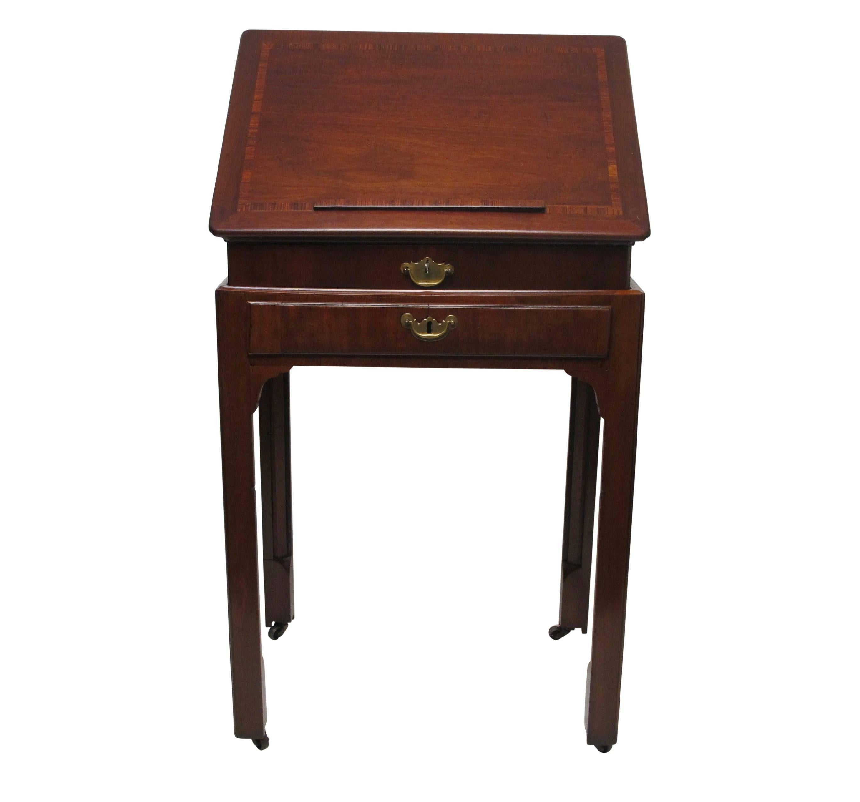 Wonderful old portable podium style reading stand or lectern. Mahogany with satinwood and rosewood inlay, the top having an adjustable support to raise and lower the reading angle. The lower section with two drawers, and having interesting and