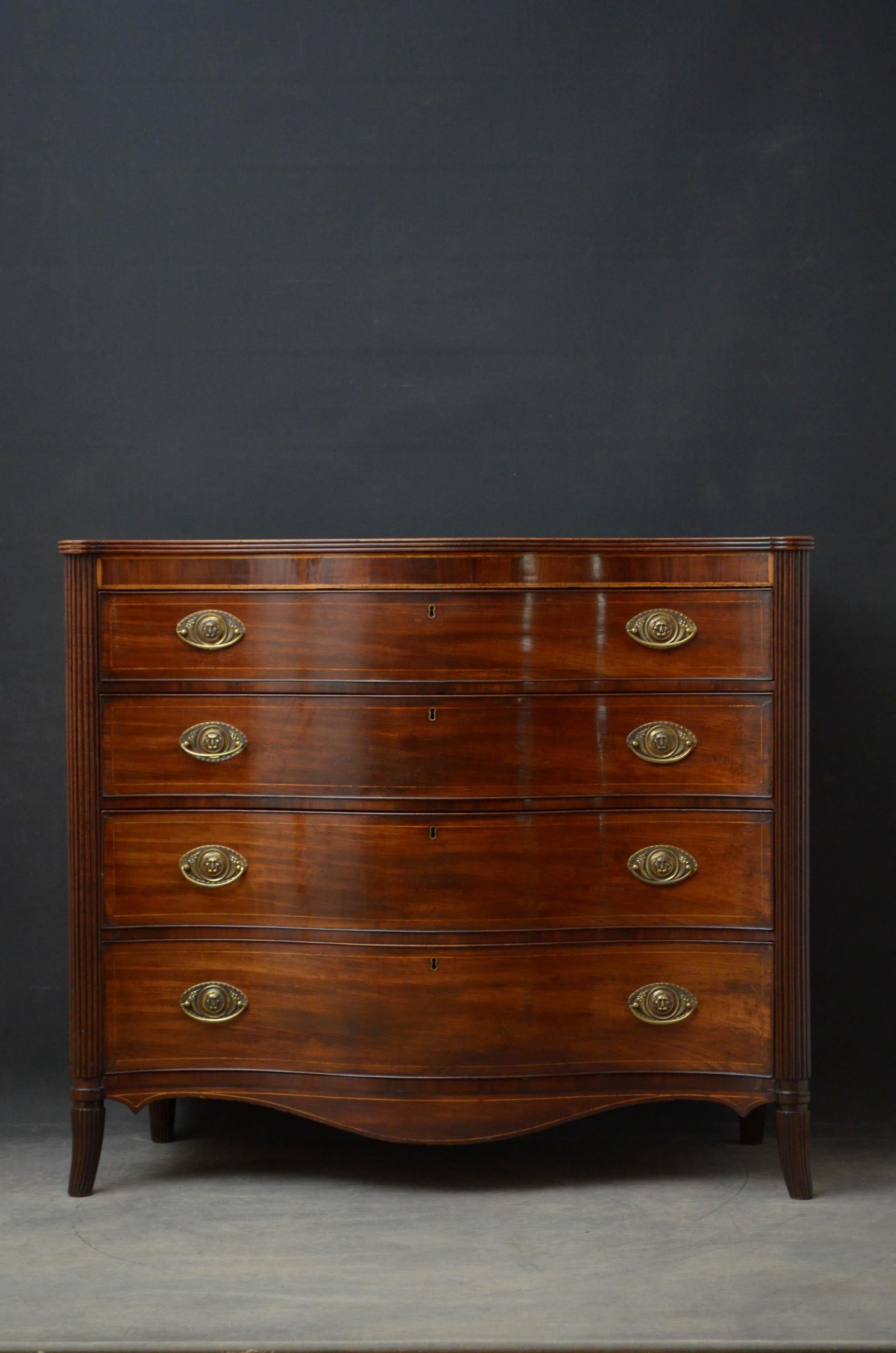 Sn4819 Superb George III chest of drawers in mahogany, having serpentine top with reeded edge above satinwood inlaid frieze and 4 graduated string inlaid drawers all fitted with lion mask brass handles, flanked by fluted columns terminating in