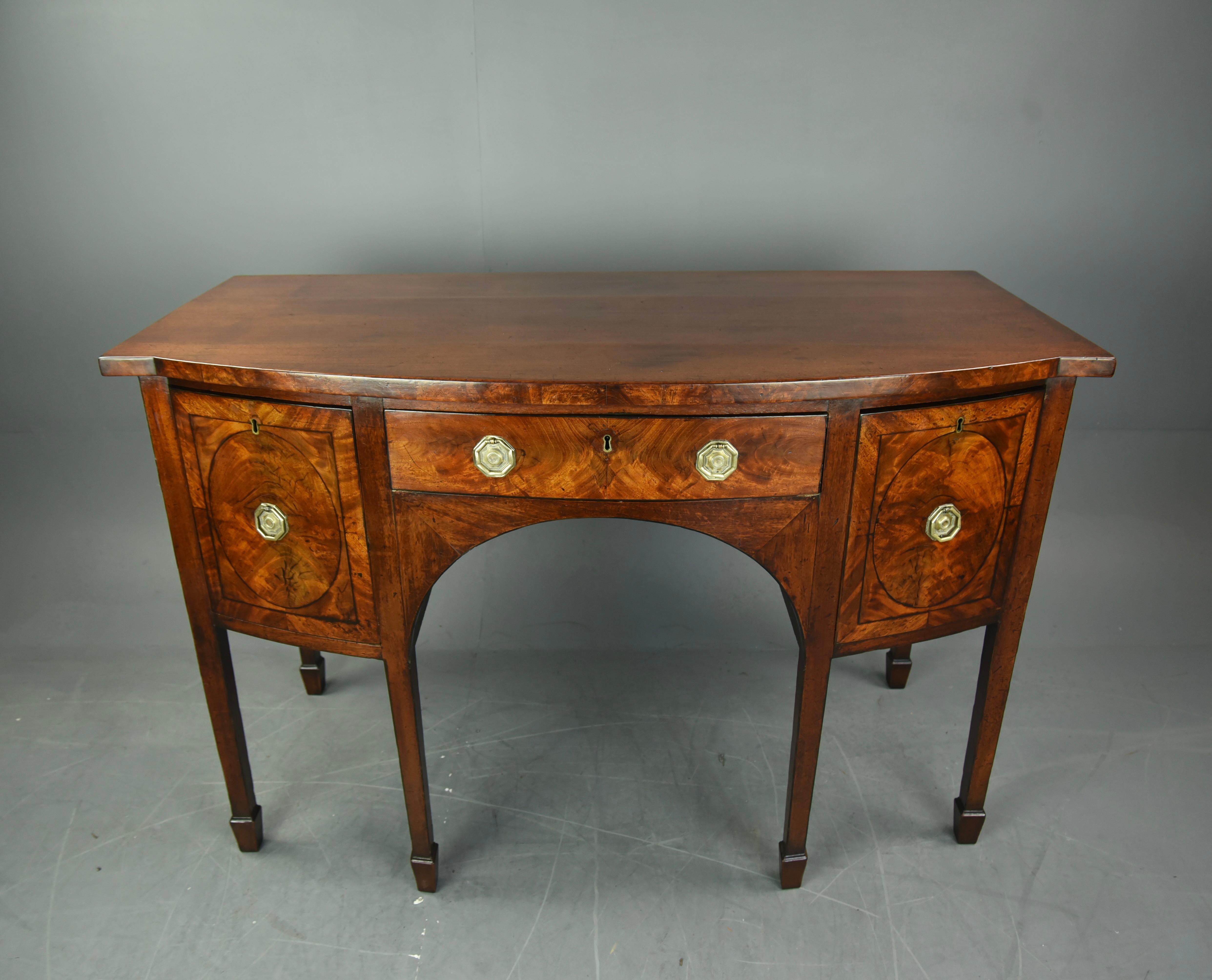 Georgian mahogany sideboard circa 1800.
The sideboard has a wonderful colour and grain with two deep drawers and a centre drawer with a working lock and key .that are all solid and slide nice and smooth as they should.
It stands on six square