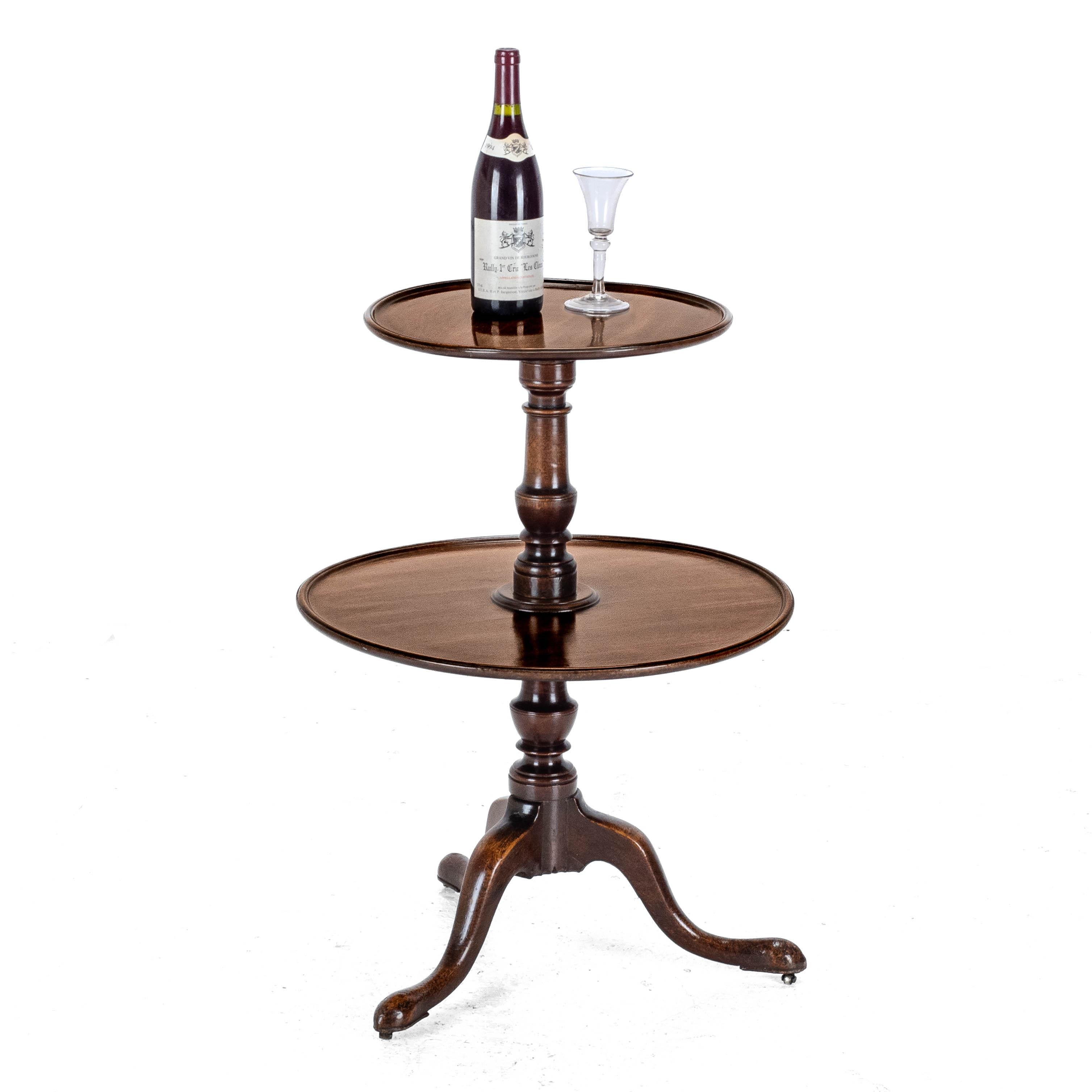 A George III period, small mahogany dumb waiter tripod table, circa 1800. A quality, original dumb waiter, featuring a well figured, single piece top and lower tier both in solid mahogany. Supported by a baluster stem, raised on a tripod of carved