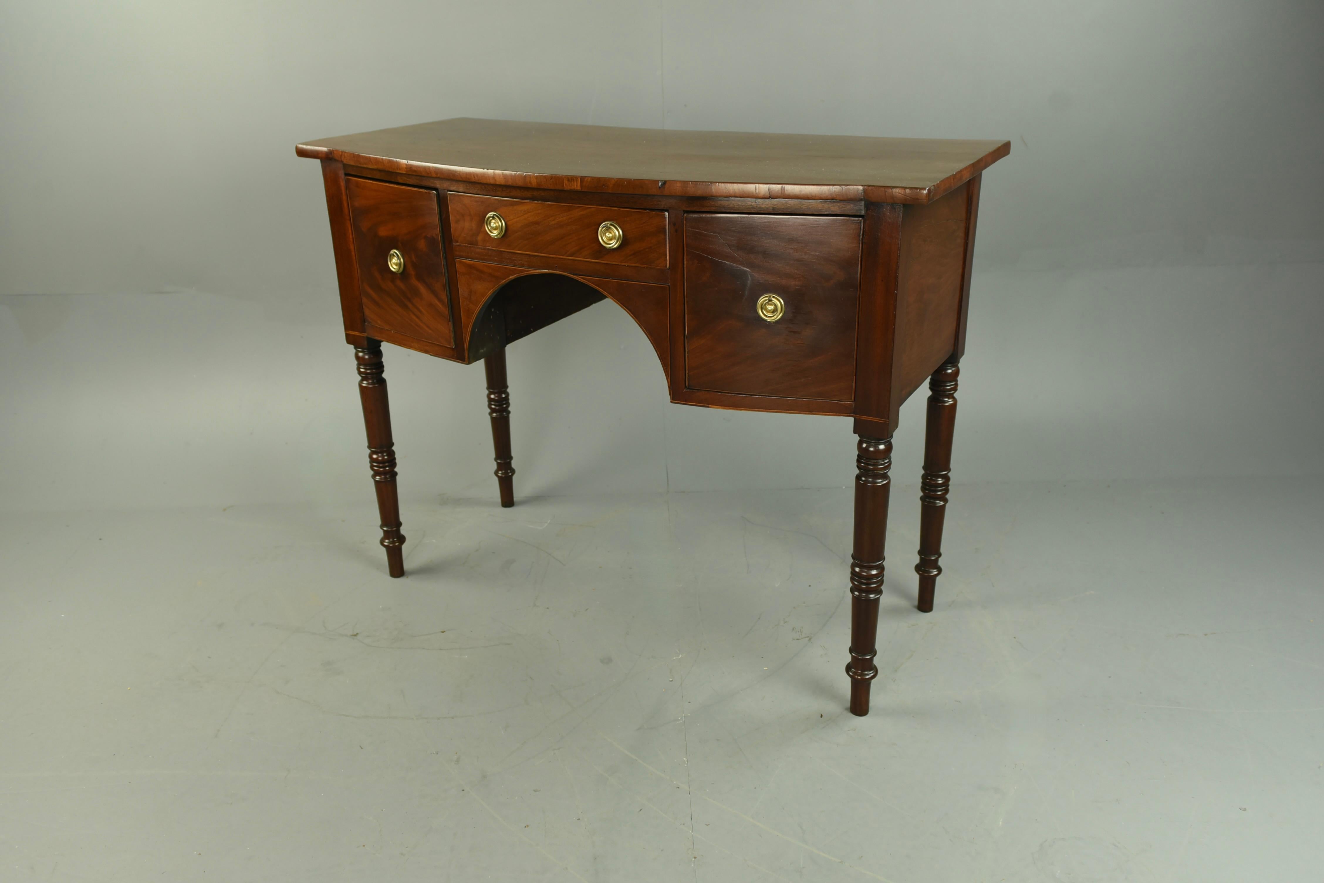 Wonderful small Georgian mahogany sideboard circa 1810 .
The sideboard has a wonderful rich mahogany colour with a very good grain ,It a useful deep drawer to each side with further drawer in the centre ,it stands on fine turned mahogany legs .
The
