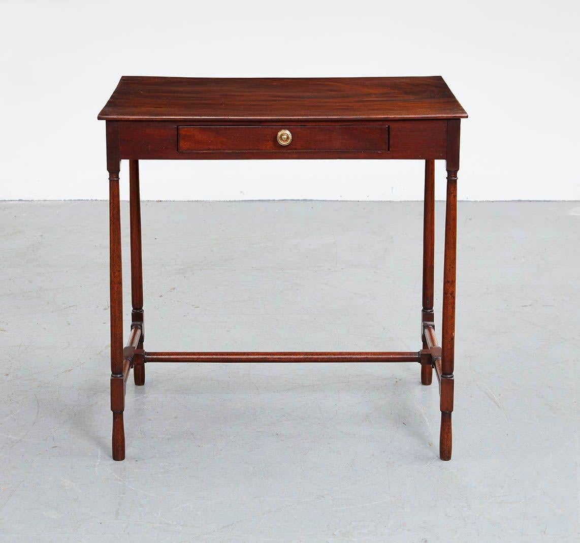 Good George III Mahogany single drawer stretcher base table, the single plank top with vivid graining, over single drawer retaining original gilt brass pull and with mahogany linings and drawer bottom, standing on simple turned legs joined by