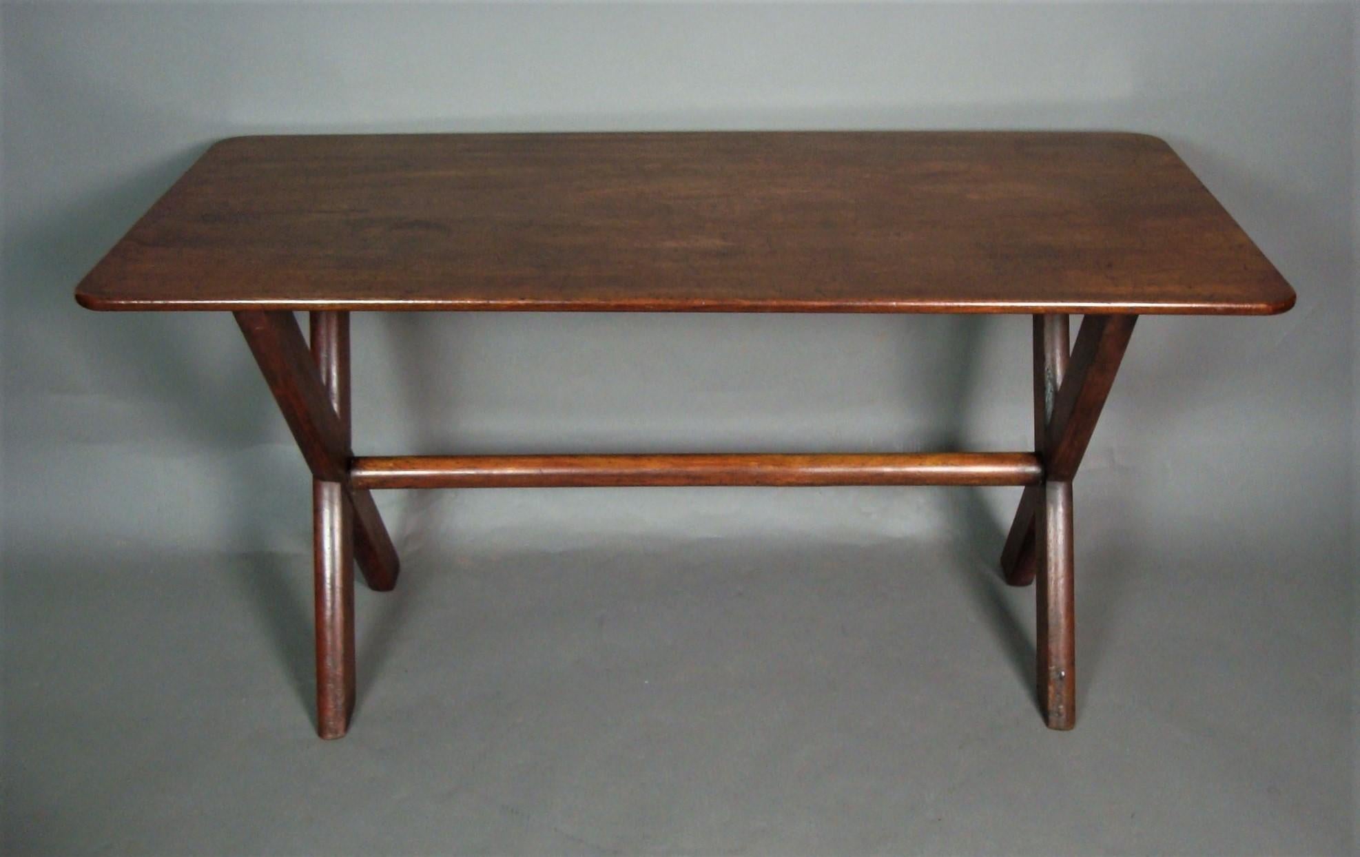 Late Georgian mahogany tavern table, the one piece mahogany rectangular top, with rounded corners raised on birch supports of typical x design, united by an unusual turned pole stretcher.
English, circa 1830
Good original condition, good colour