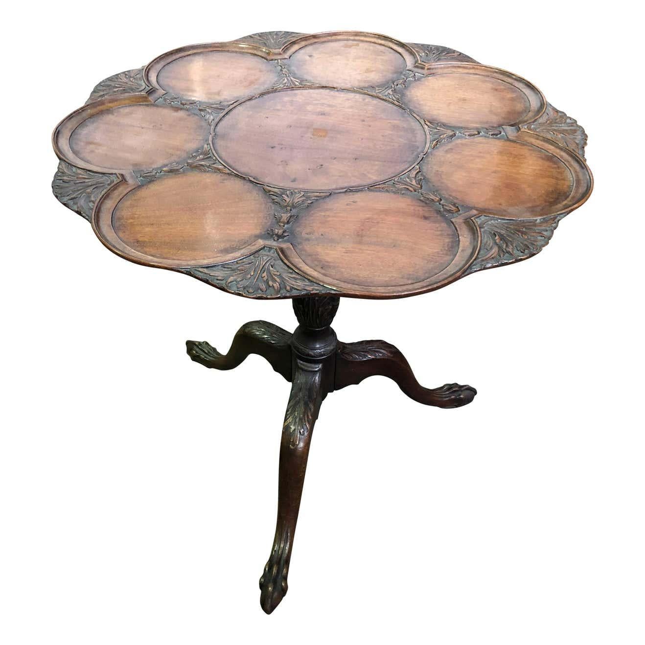 A Gorgeous mahogany Georgian style circular tilt-top supper table with eight place settings. With an acanthus-carved tripod base.