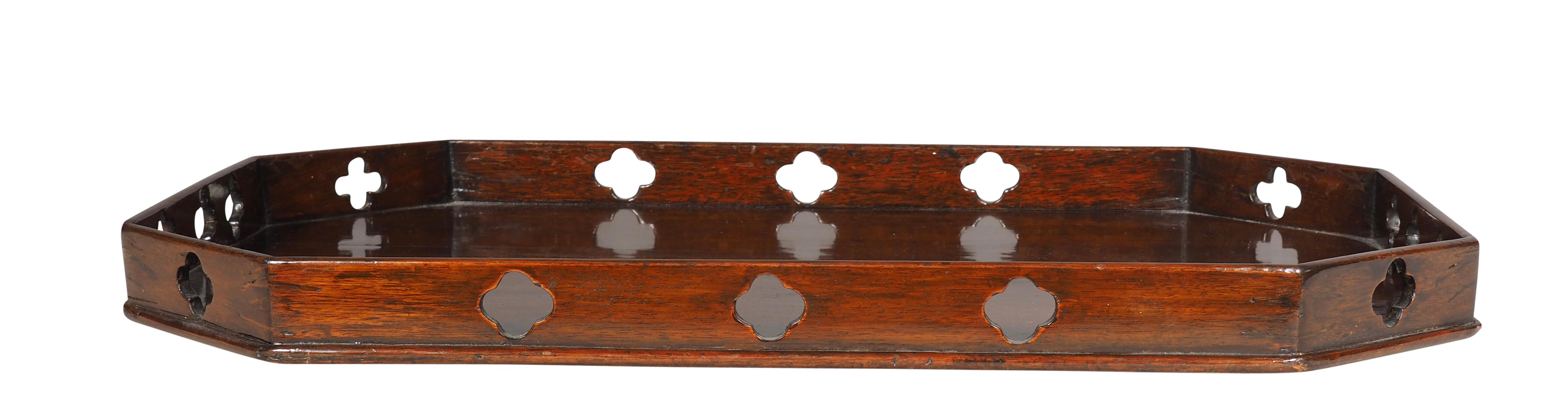 Rectangular with eight sides with quatrefoil cutouts. 