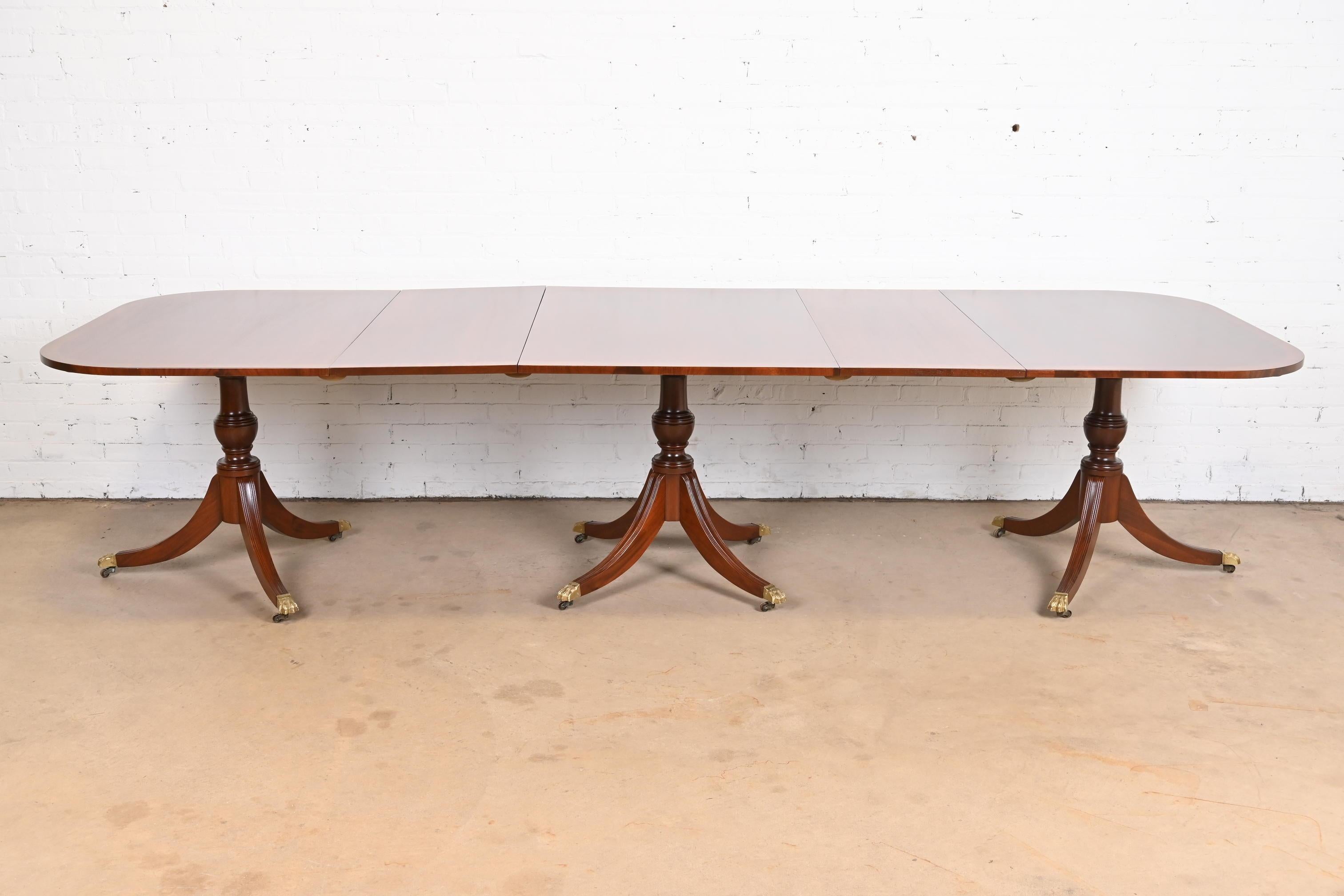 Georgian Mahogany Triple Pedestal Dining Table in the Manner of Baker Furniture For Sale 4