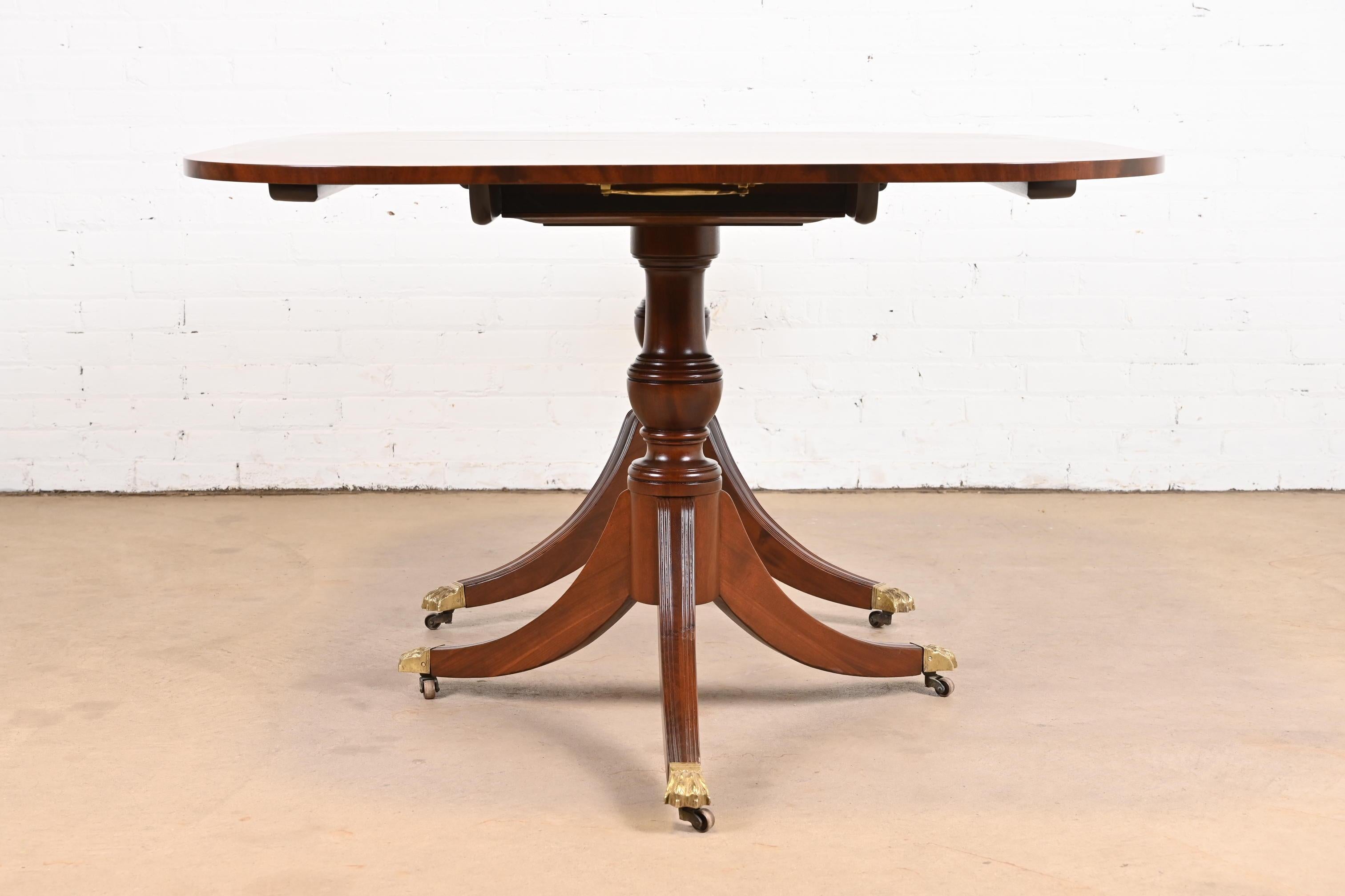 Georgian Mahogany Triple Pedestal Dining Table in the Manner of Baker Furniture For Sale 9