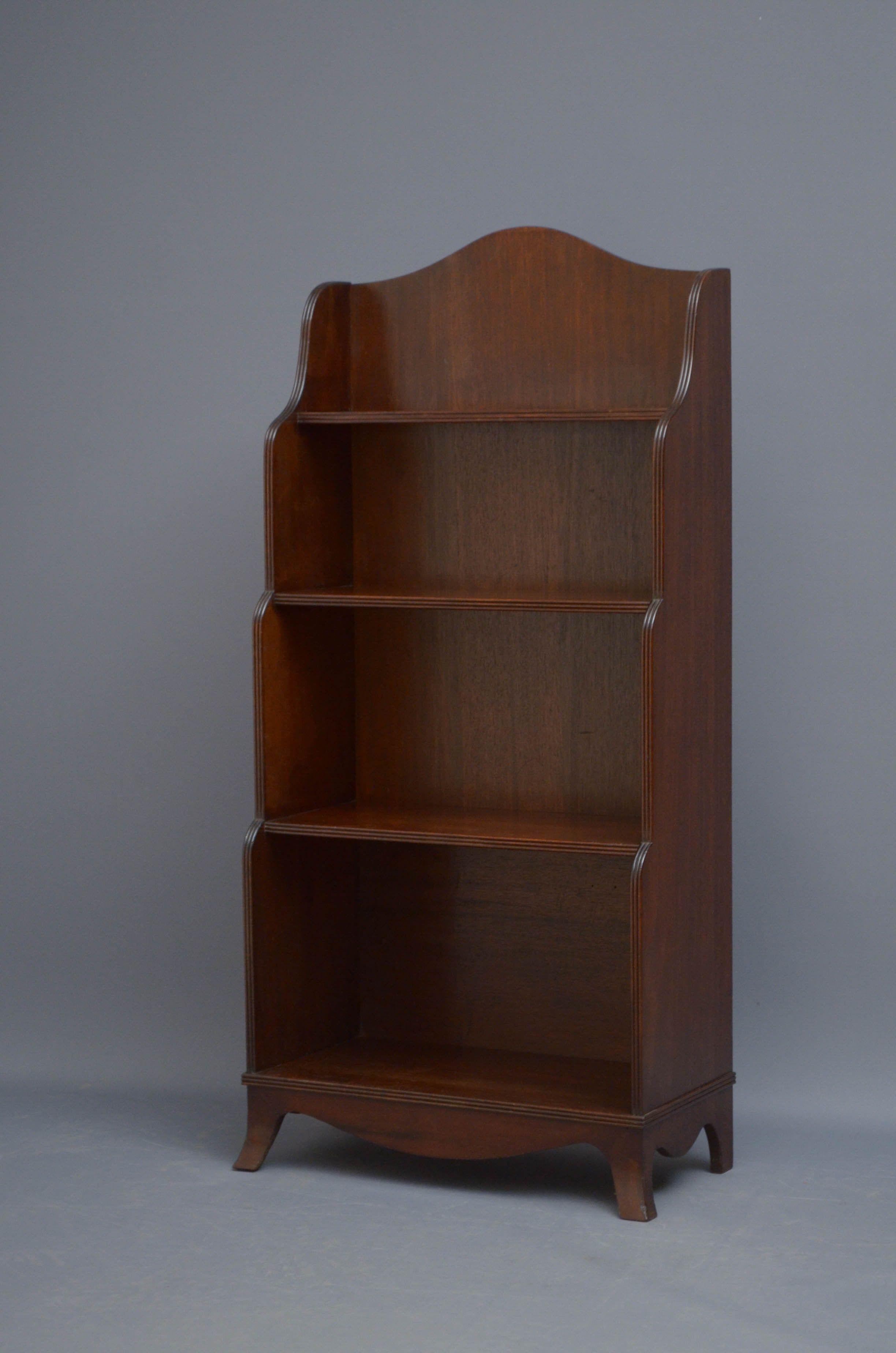 Sn5231 A solid mahogany early XIXth century waterfall bookcase with reeded decoration to the shelf fronts and sides, standing on splayed feed united by shaped apron. This antique bookcase retains its original wax finish, patina and soft colour, all