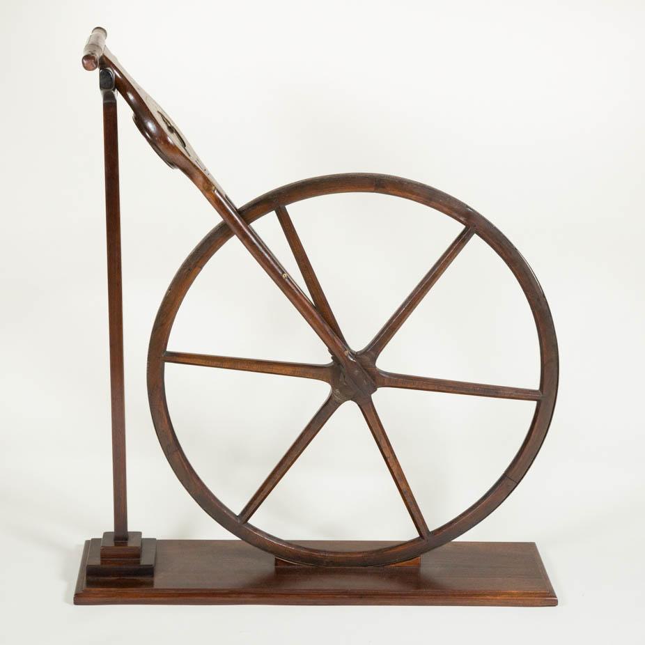 A mahogany Waywiser by Richard Glynne of Fleet Street, London, circa 1725. 

Diameter of wheel: 31 1/2 inches - 80 cm.

With modern display stand. 

The brass dial is graduated in poles, furlongs and miles, dial centre ornately engraved and
