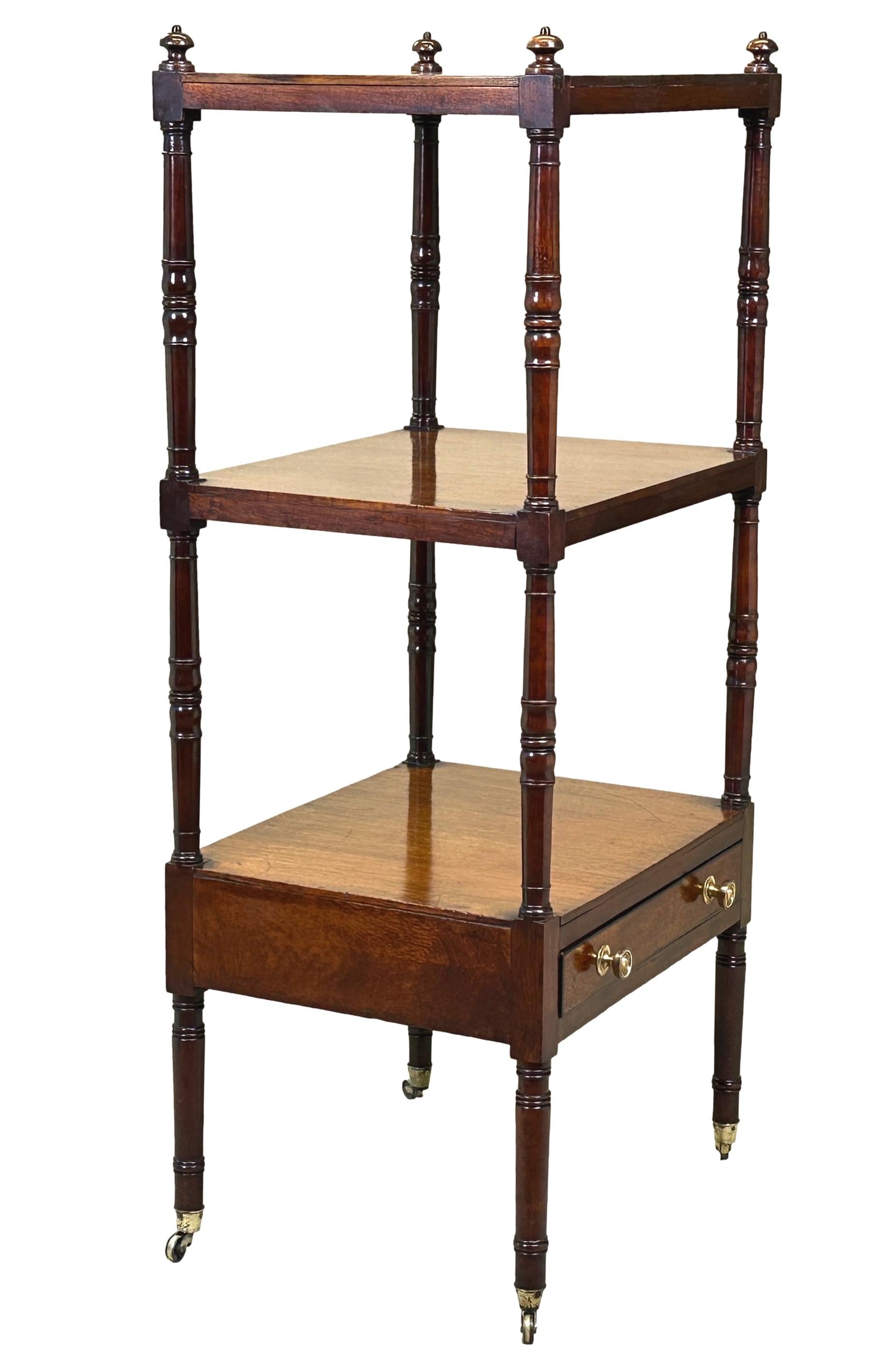 A fine quality, 18th century, George III Period mahogany whatnot of charming small proportion, having three well figured rectagular tiers, United by turned upright supports and one frieze drawer, raised on extremely elegant tall turned legs