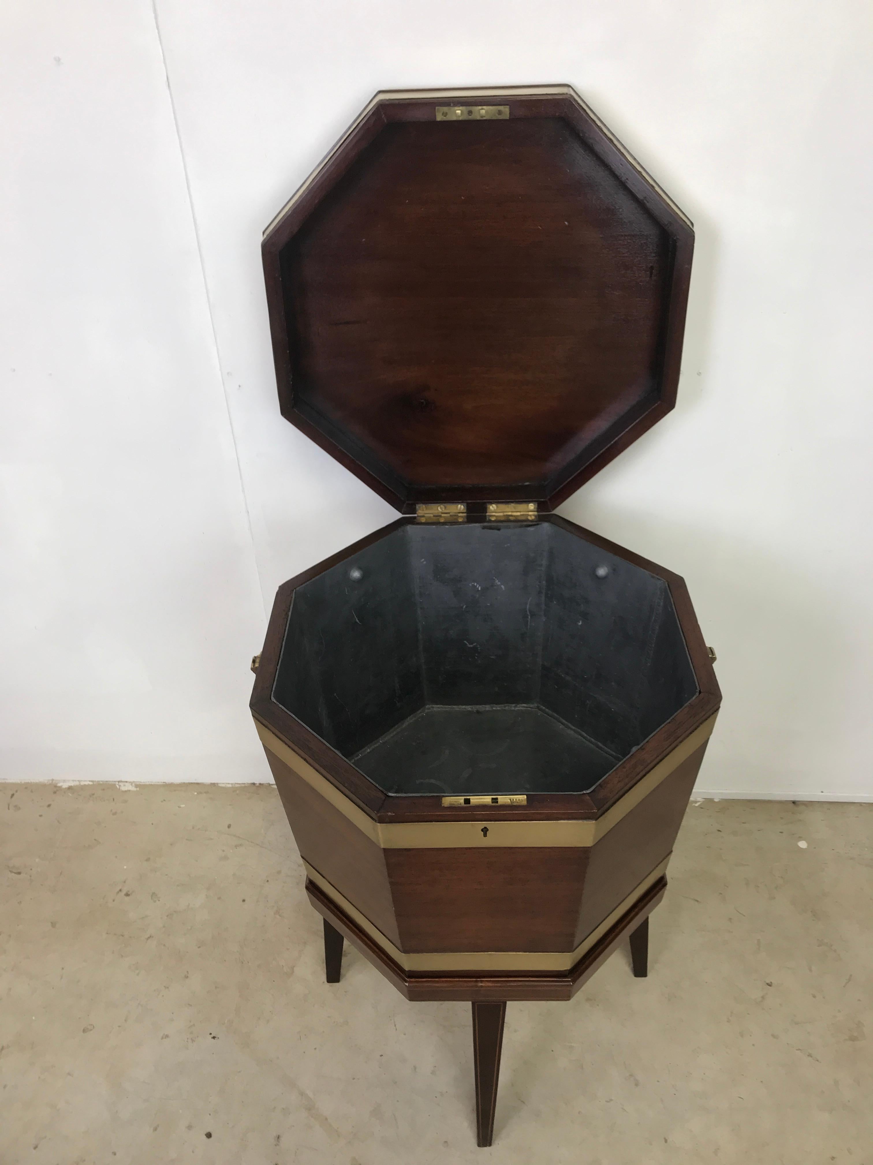 A very nice large Georgian mahogany octagonal wine cooler with brass bands and handles
This one has a drain in the base to make it very easy after your ice has melted to drain
It has being cleaned and polished and is ready for your Wine.