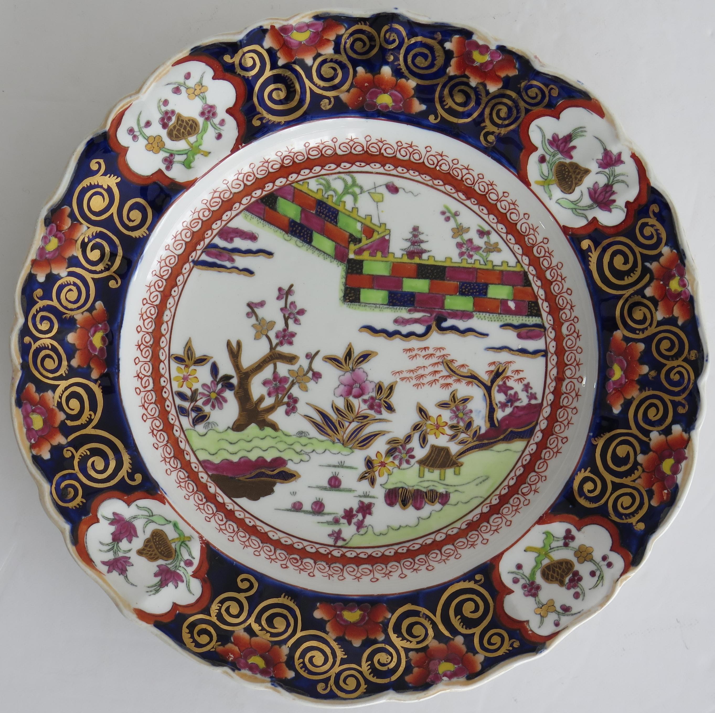 This is an early-19th century Mason’s patent ironstone Desert Plate produced by Mason's Ironstone, England and dating to their earliest period, circa 1815 to 1820.

This plate is beautifully hand decorated in a striking chinoiserie pattern called