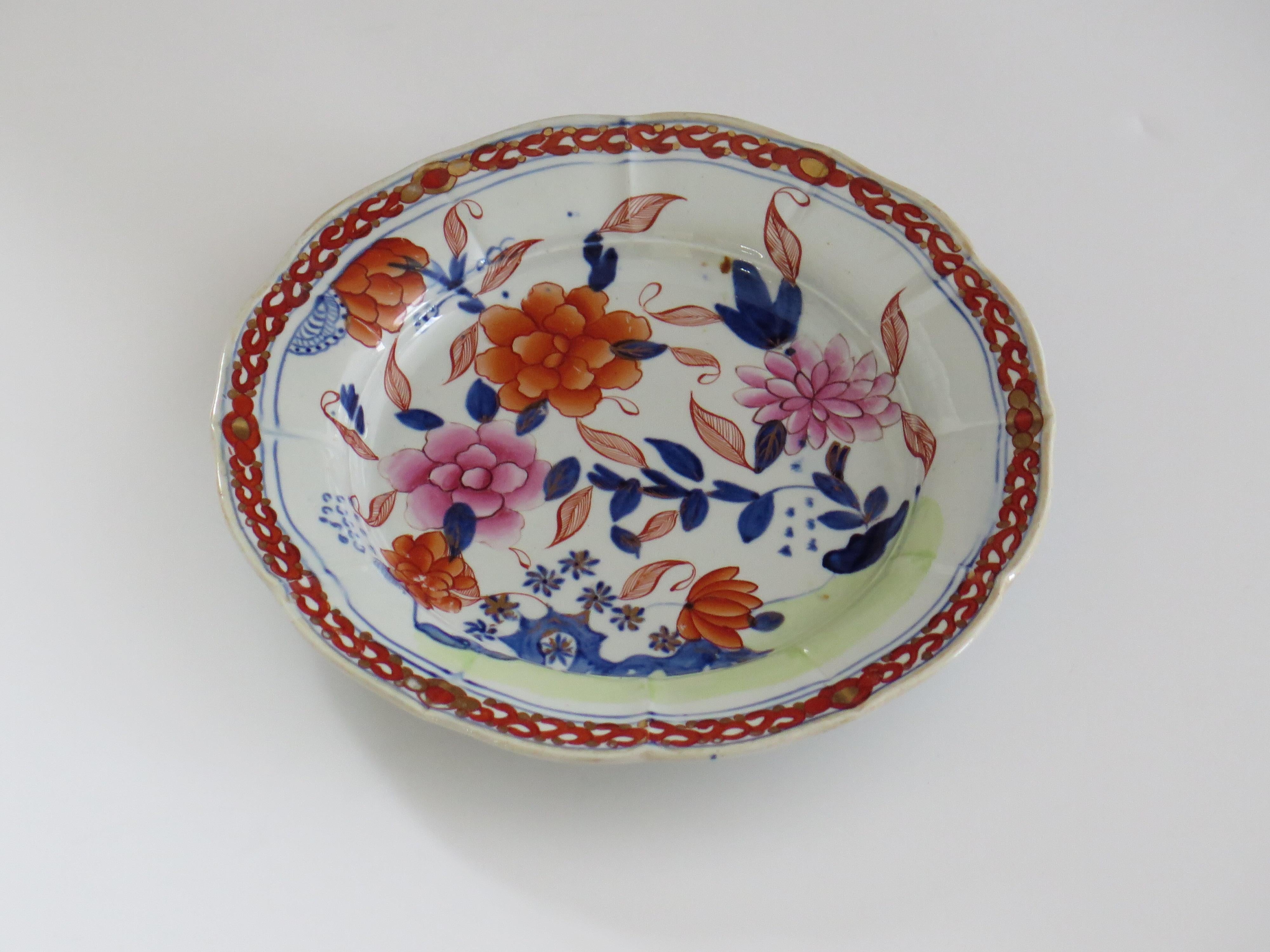 This is a very good hand painted Mason's ironstone Desert Plate, in the Pink Rose on stem with Rock gilded pattern, from their earliest George IIIrd period, circa 1818.

The piece is well potted with a circular shape having a wavy edge and ribbed