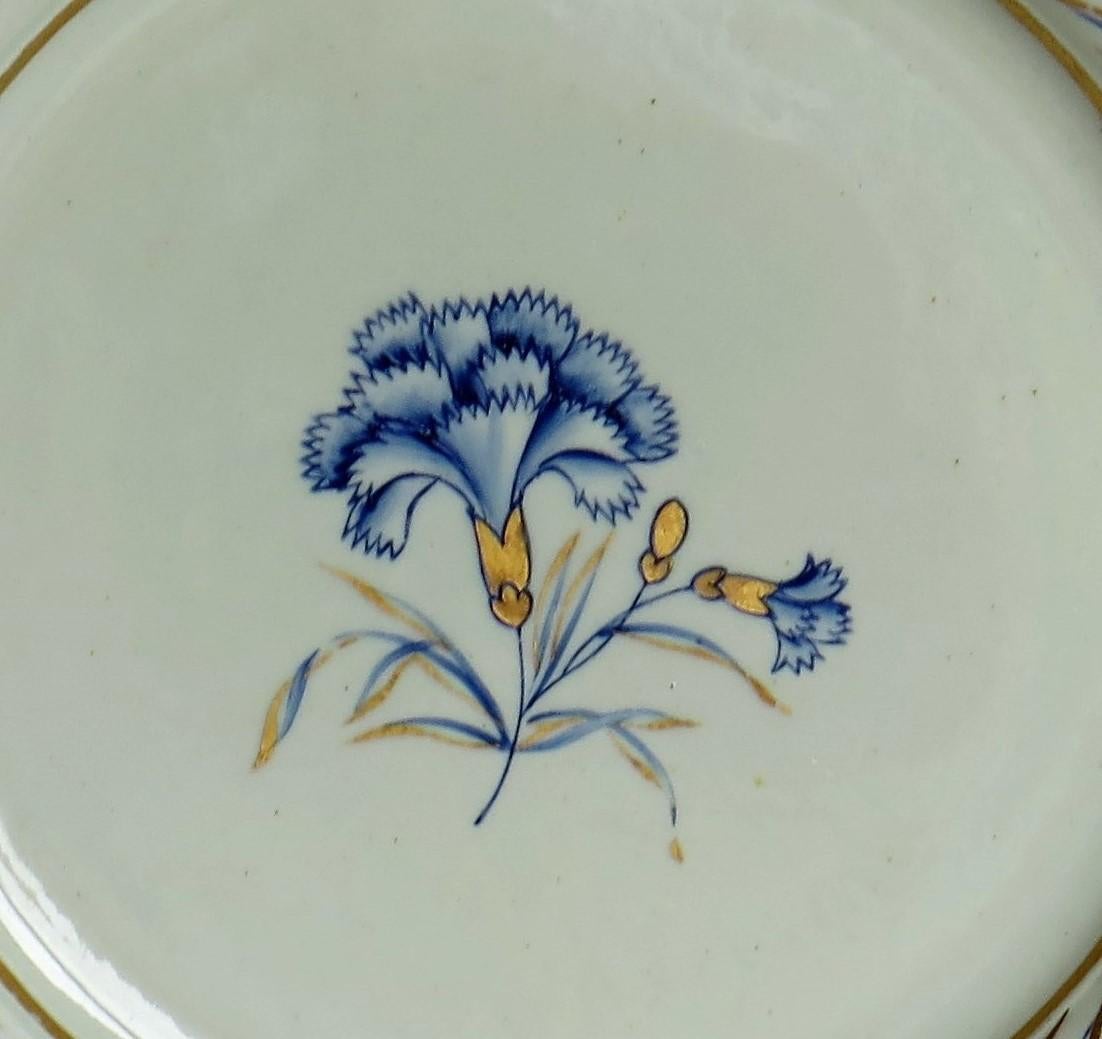 This distinctive ironstone pottery dinner plate was made by the Mason's factory at Lane Delph, Staffordshire, England and is hand decorated in the 