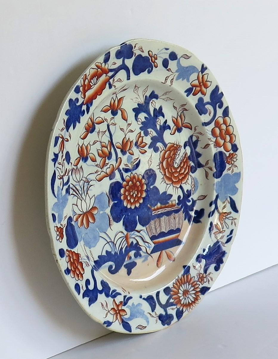 This is a good early Mason's Ironstone pottery dinner plate, hand painted in the very decorative basket Japan pattern, produced by the Mason's factory at Lane Delph, Staffordshire, England, in the George 111rd period, circa 1813-1820.

The plate