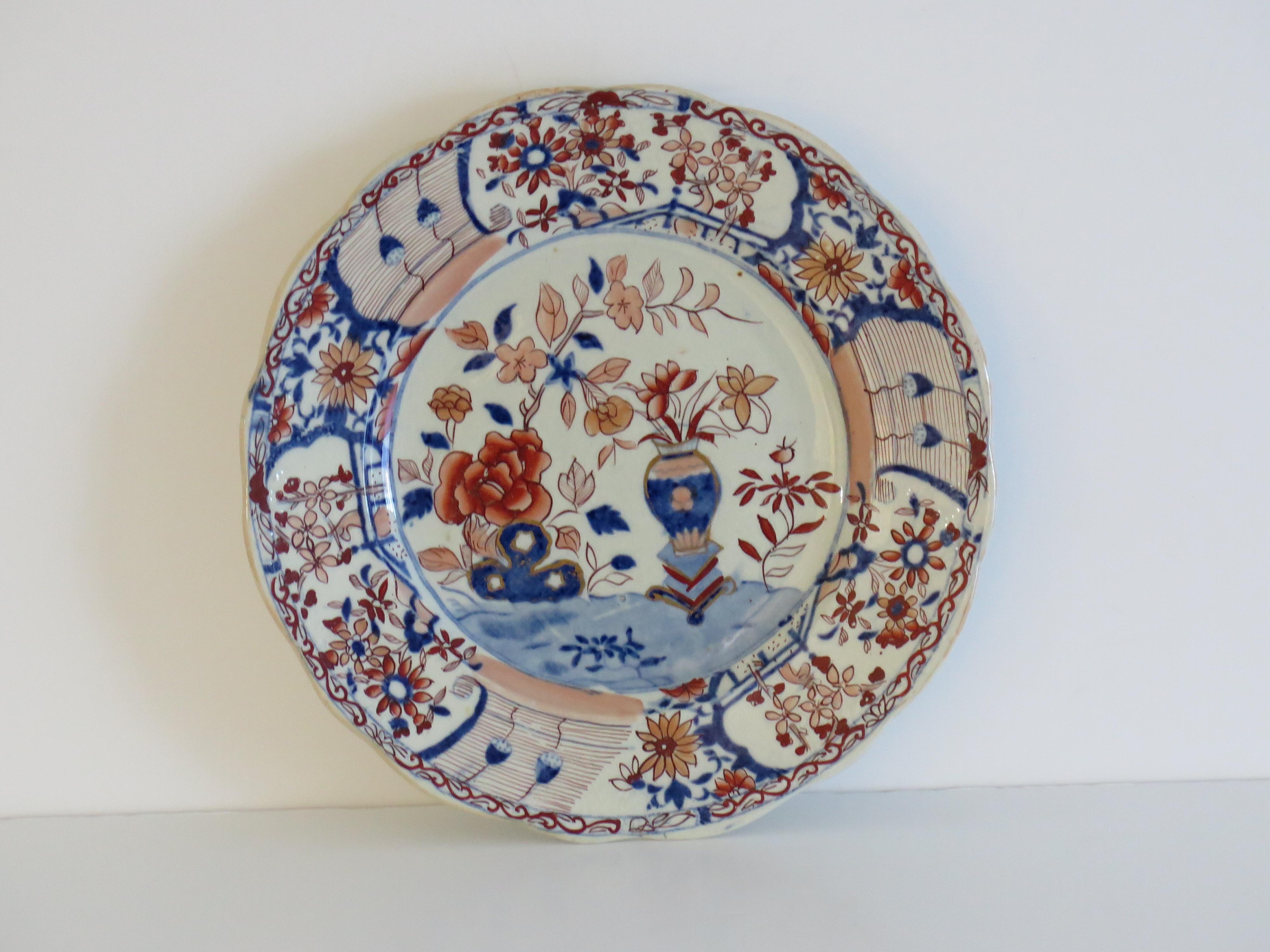 This is a very decorative ironstone pottery Plate produced by the Mason's factory at Lane Delph, Staffordshire, England, circa 1818.

The plate is circular with a wavy indented edge & moulded floral detail to the inner rim edge .

This Plate is