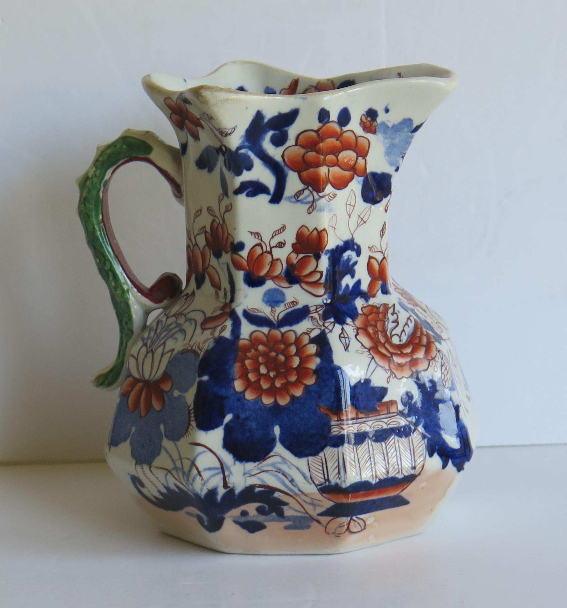 This is a good, early Mason's Ironstone Hydra jug or pitcher in the Basket Japan pattern, made in the English, late Georgian period, circa 1815-1820.

The jug has the octagonal 