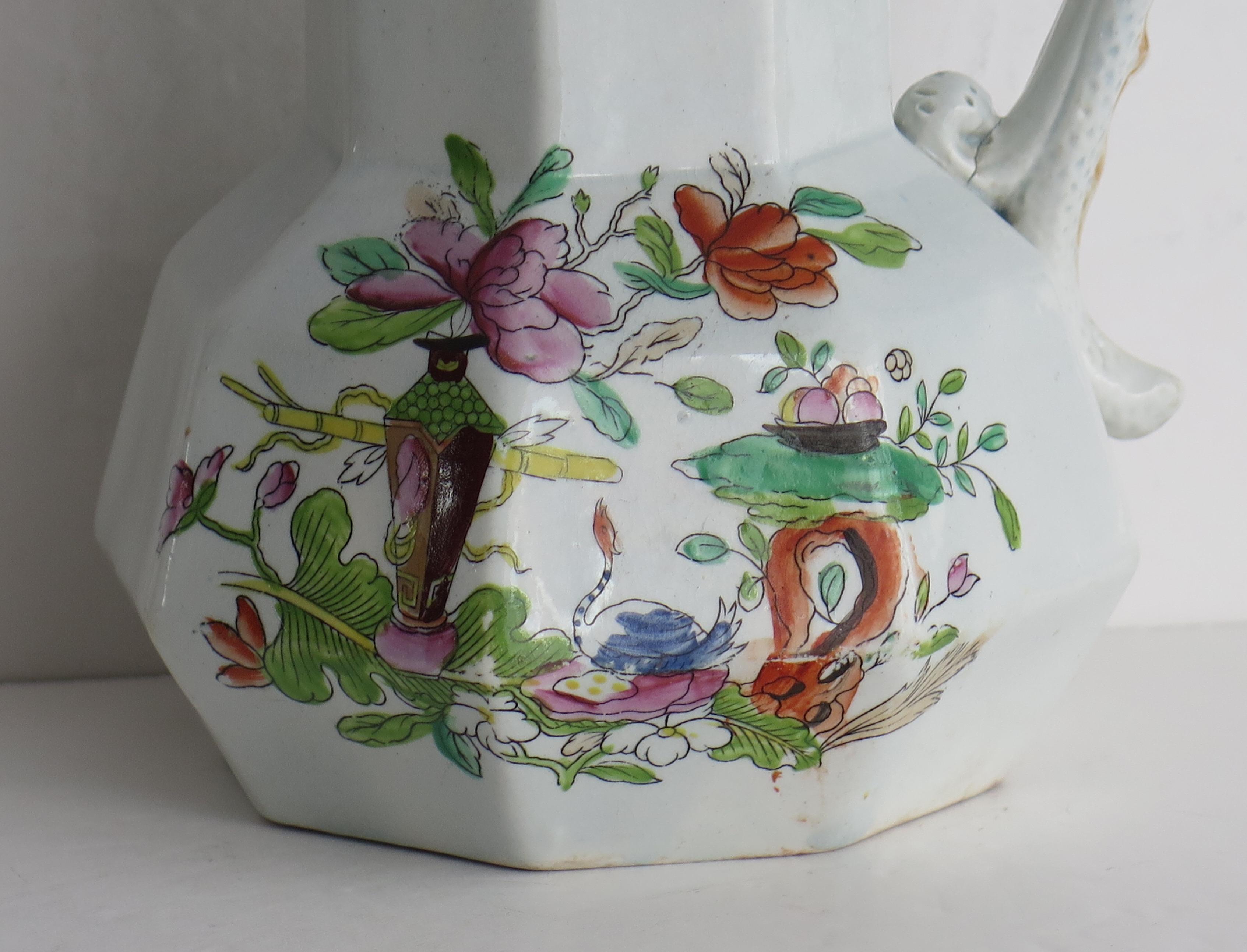 This is a hand-painted Mason's ironstone jug or pitcher, in the Table and Flower Pot gilded pattern, from their earliest George 3rd period, circa 1820. 

The jug is well potted in their octagonal 