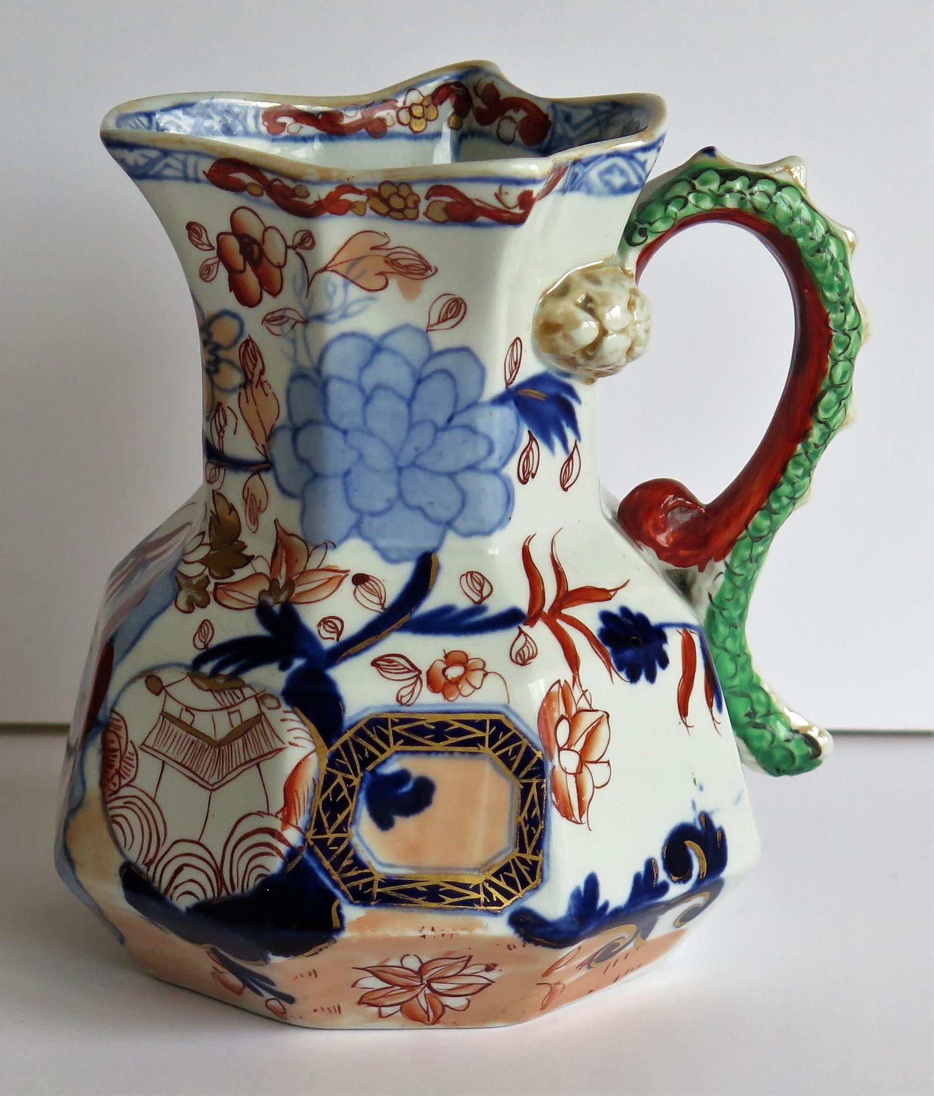 This is a good, very early Mason's Ironstone Hydra jug or pitcher in the gilded Jardiniere pattern, dating to the late George 111rd period, circa 1813-1815. 

The jug has an octagonal hydra shape with a notched snake handle and is hand decorated