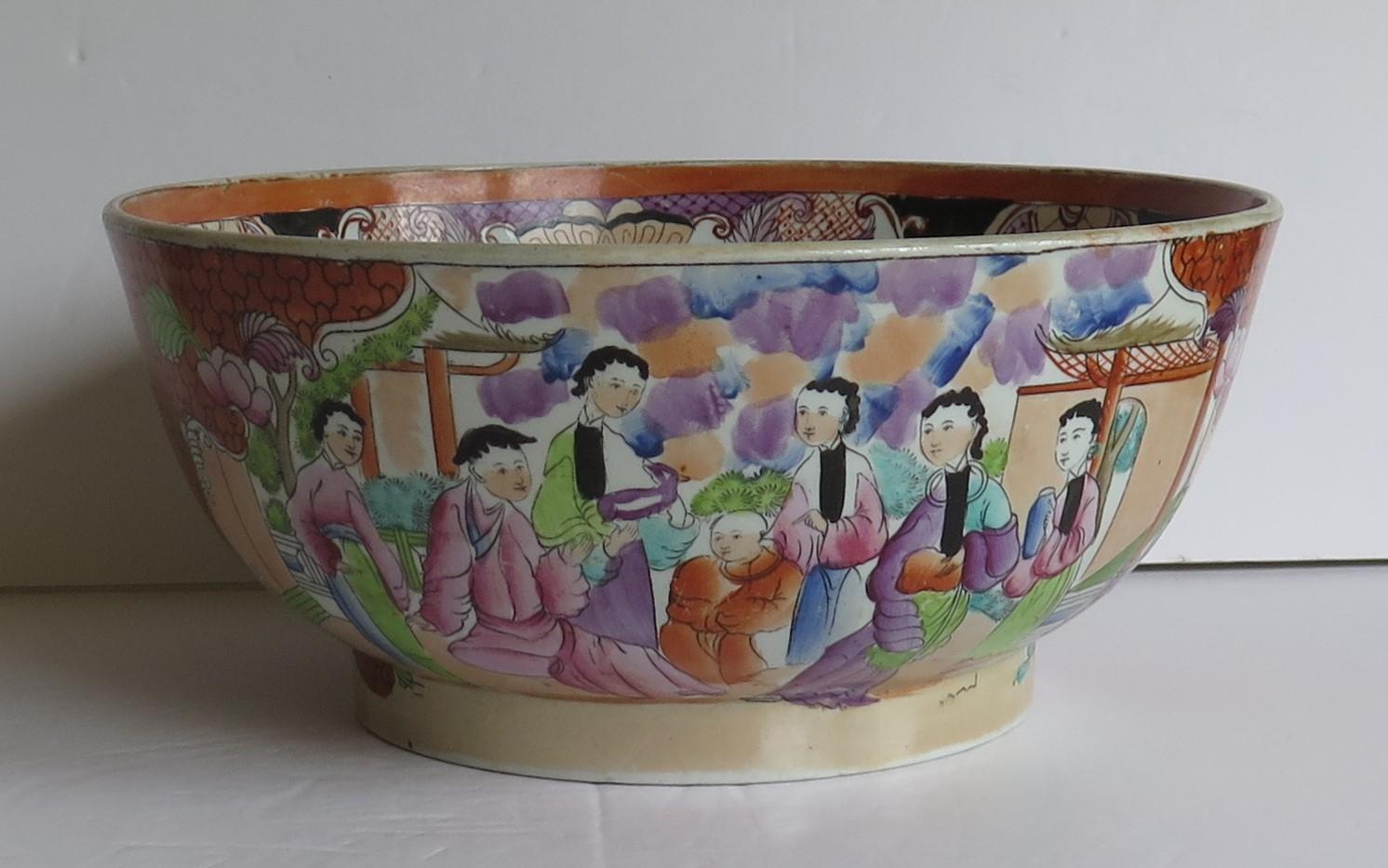 This is a beautiful Mason's Ironstone pottery large bowl in the very decorative Red Scale Sacrificial Lamb, oriental people pattern, produced by the Mason's factory at Lane Delph, Staffordshire, England, circa 1813-1815.

This large bowl is well