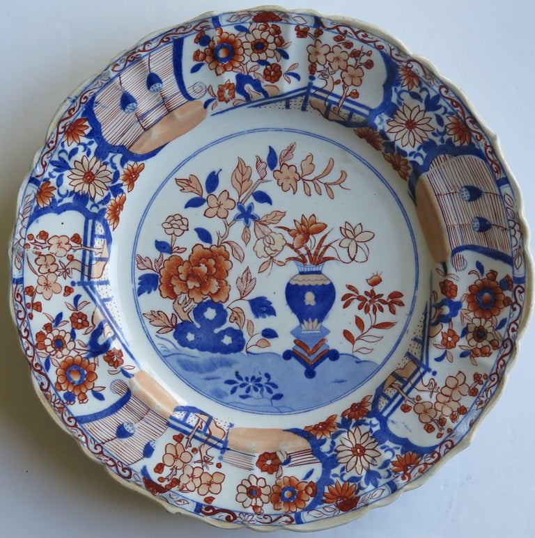 This is an early and very decorative ironstone pottery large dinner plate produced by the Mason's factory at Lane Delph, Staffordshire, England, circa 1815 to 1820.

The plate is circular with an attractive wavy edge to the rim.

This plate is
