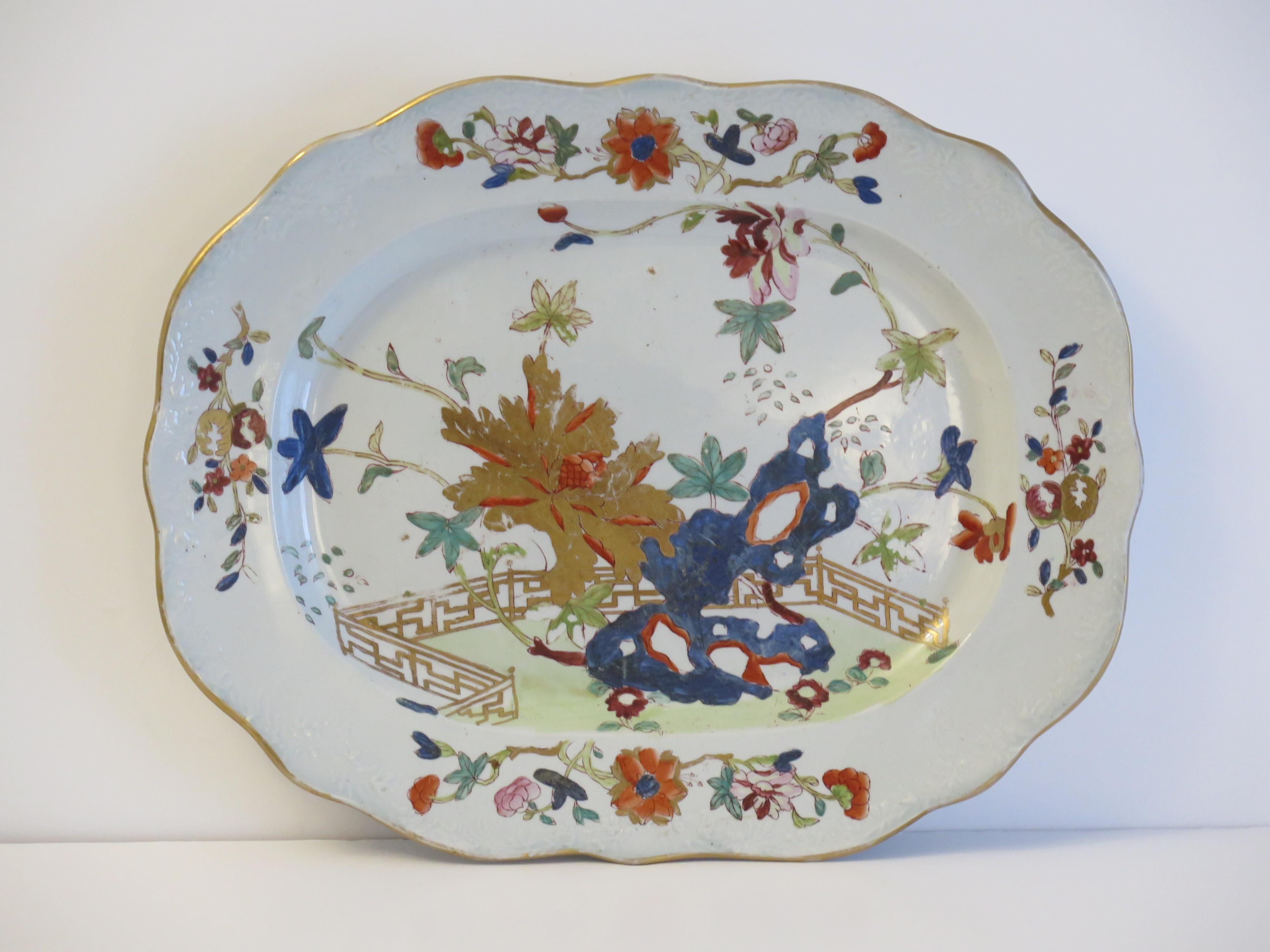 This is a very good hand painted Mason's ironstone large Platter or Meat Plate, in the Fence, Rock and Tree gilded pattern, from their earliest George III rd period, circa 1818.

This is a large platter of 