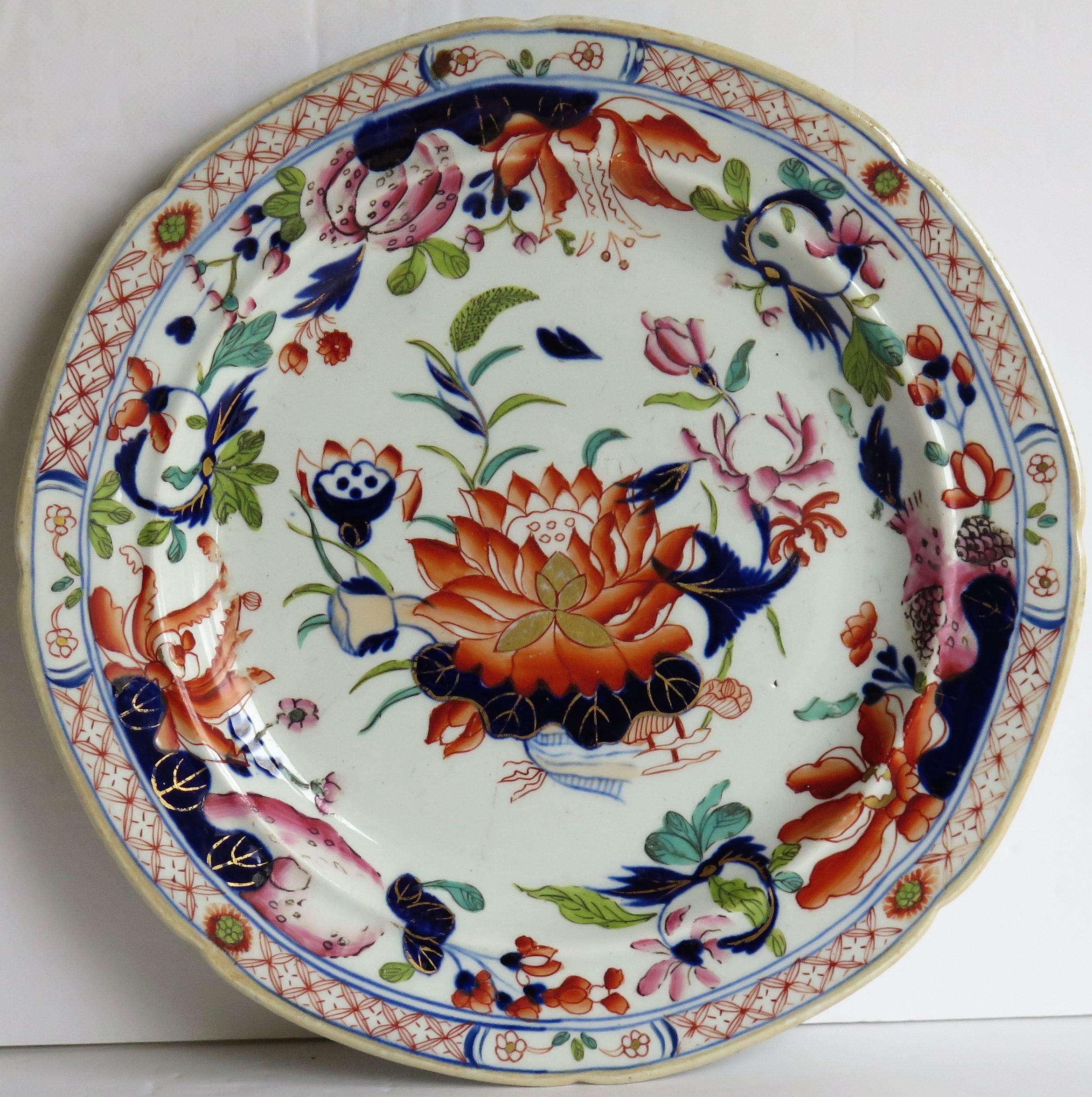 This is a very good early Mason's Ironstone pottery plate in the very decorative Water Lily pattern, produced by the Mason's factory at Lane Delph, Staffordshire, England, circa 1813-1820.

The plate is circular with radial ribs and a slightly