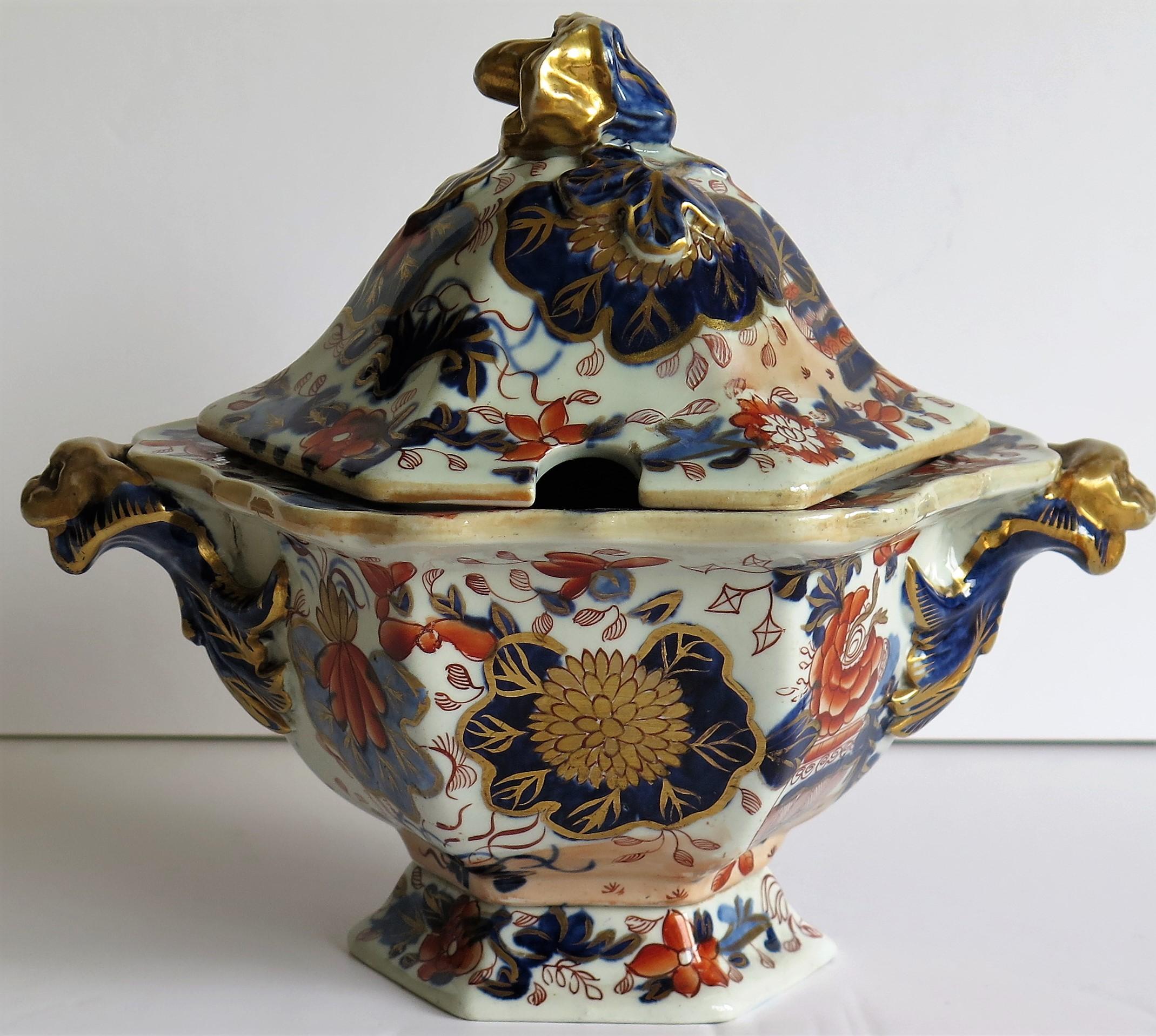 This is a superb Ironstone Sauce Tureen, complete with lid , made by Mason's of Lane Delph, Staffordshire, England, during the early part of the 19th century, circa 1820.

This tureen is well potted and is hexagonal in shape with moulded animal