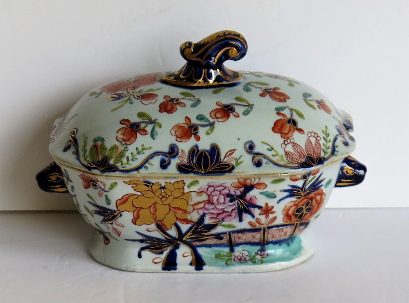This is a superb Ironstone Sauce Tureen, complete with lid, made by Mason's of Lane Delph, Staffordshire, England, during the early part of the 19th century, circa 1815.

This tureen is well potted with a rectangular curved shape on a low foot.