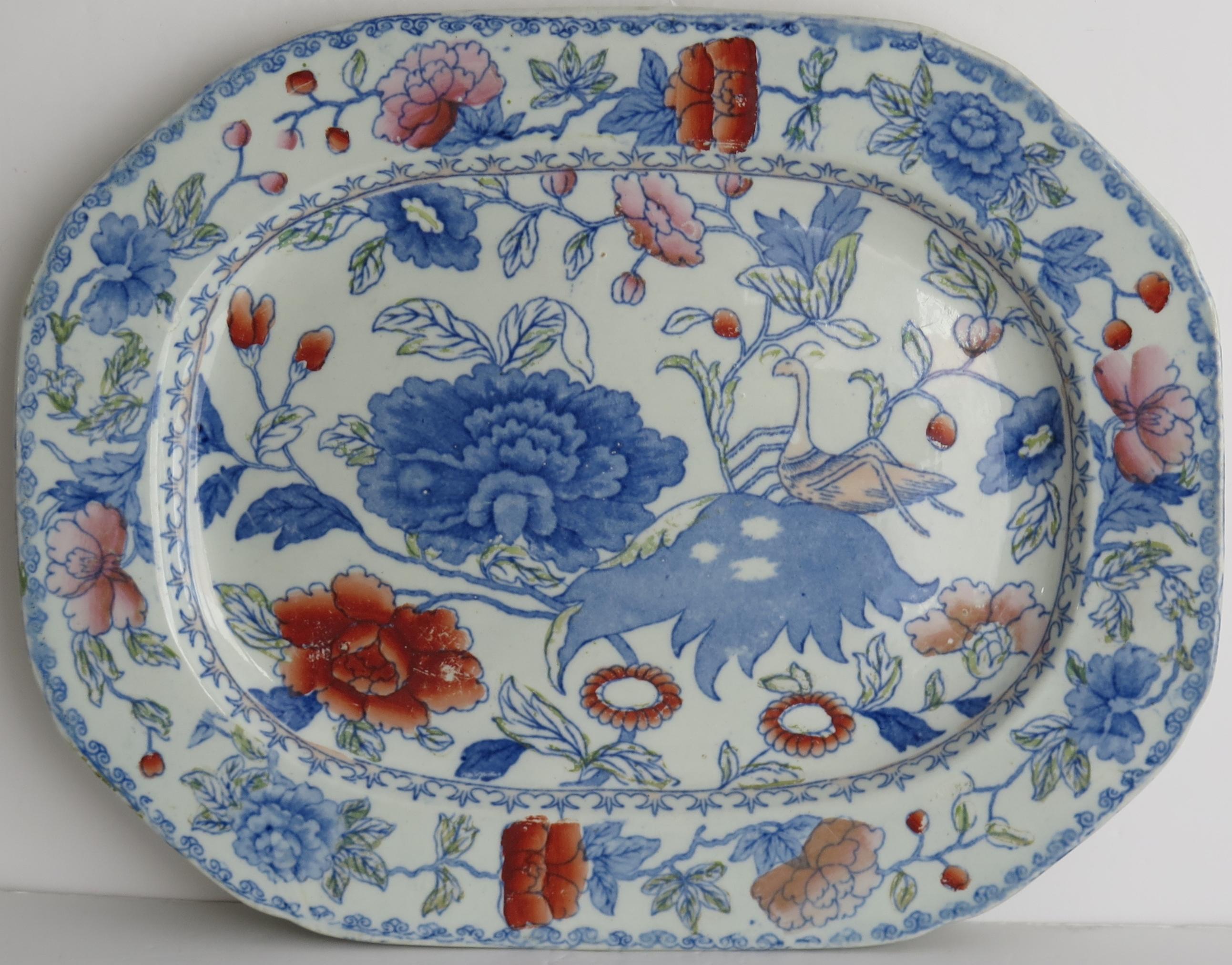 This is a good ironstone ( stone china) large platter, made by Mason's Ironstone circa 1820.

The platter is hand painted, in Mason's 