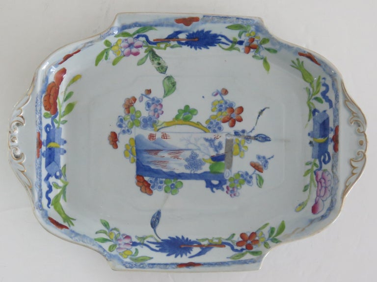 This is a very decorative rectangular serving platter by Mason's Ironstone, Lane Delph, England in the Scroll Landscape and Prunus Pattern, dating to the very early period of Mason's ironstone, circa 1820.

This Desert dish is rectangular in shape