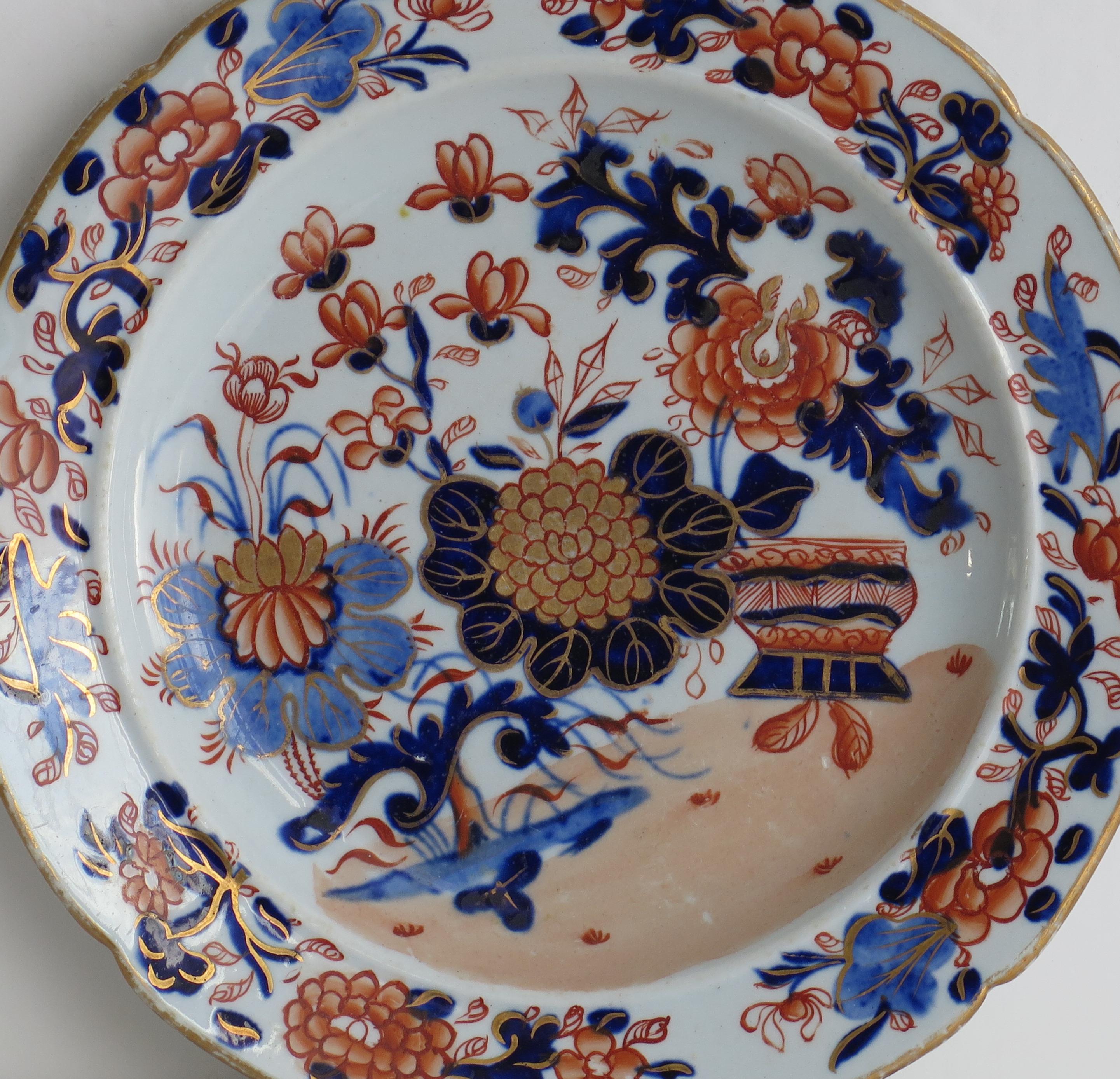 This is an early Mason's ironstone side plate hand finely hand painted in the very decorative Basket Japan gilded pattern, produced by the Mason's factory at Lane Delph, Staffordshire, England, circa 1813-1820.

The plate is circular with a