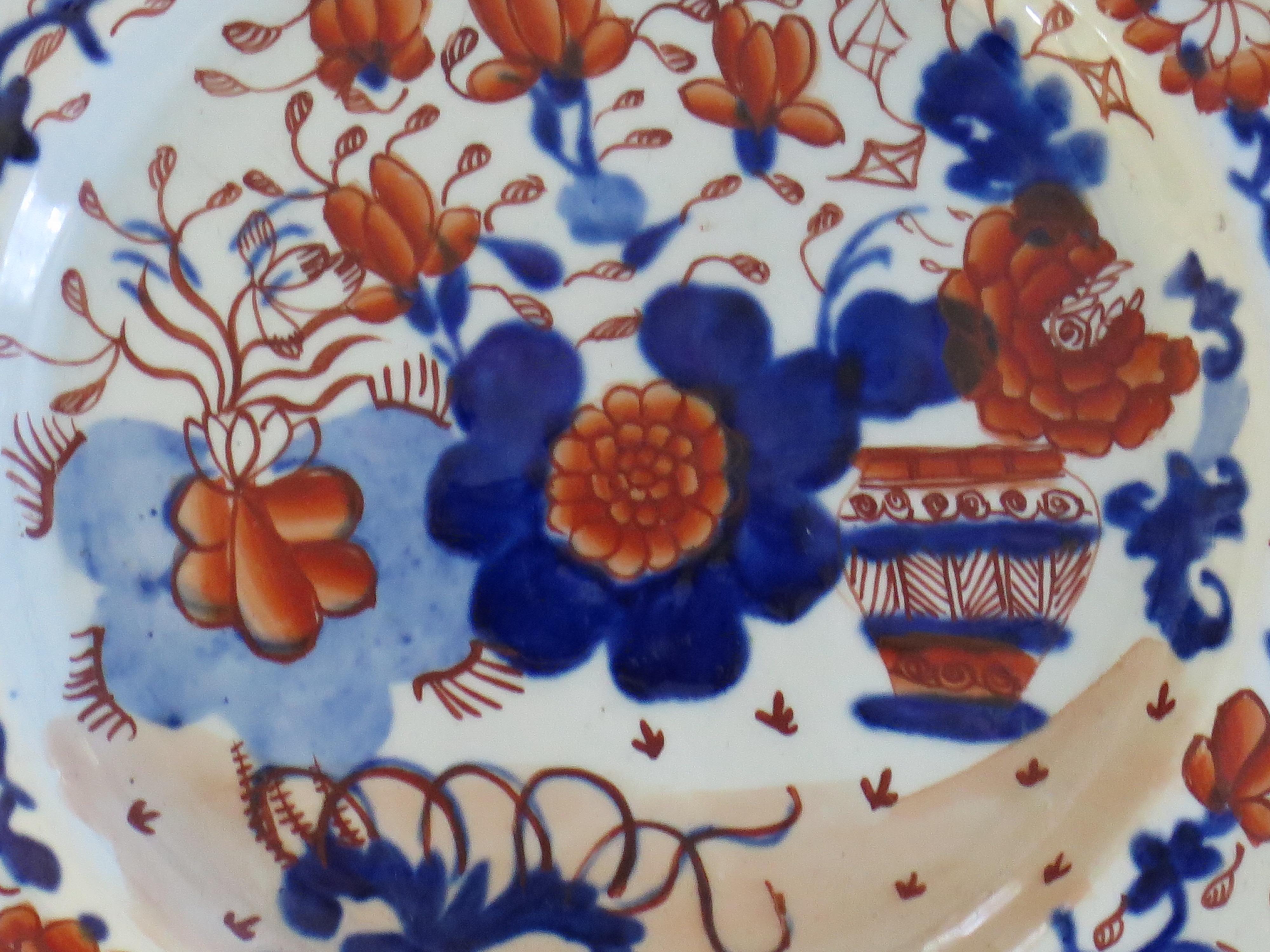 This is an early Mason's ironstone side plate, finely hand painted in the very decorative Basket Japan pattern, produced by the Mason's factory at Lane Delph, Staffordshire, England, circa 1813-1820.

The plate is circular with a notched indented