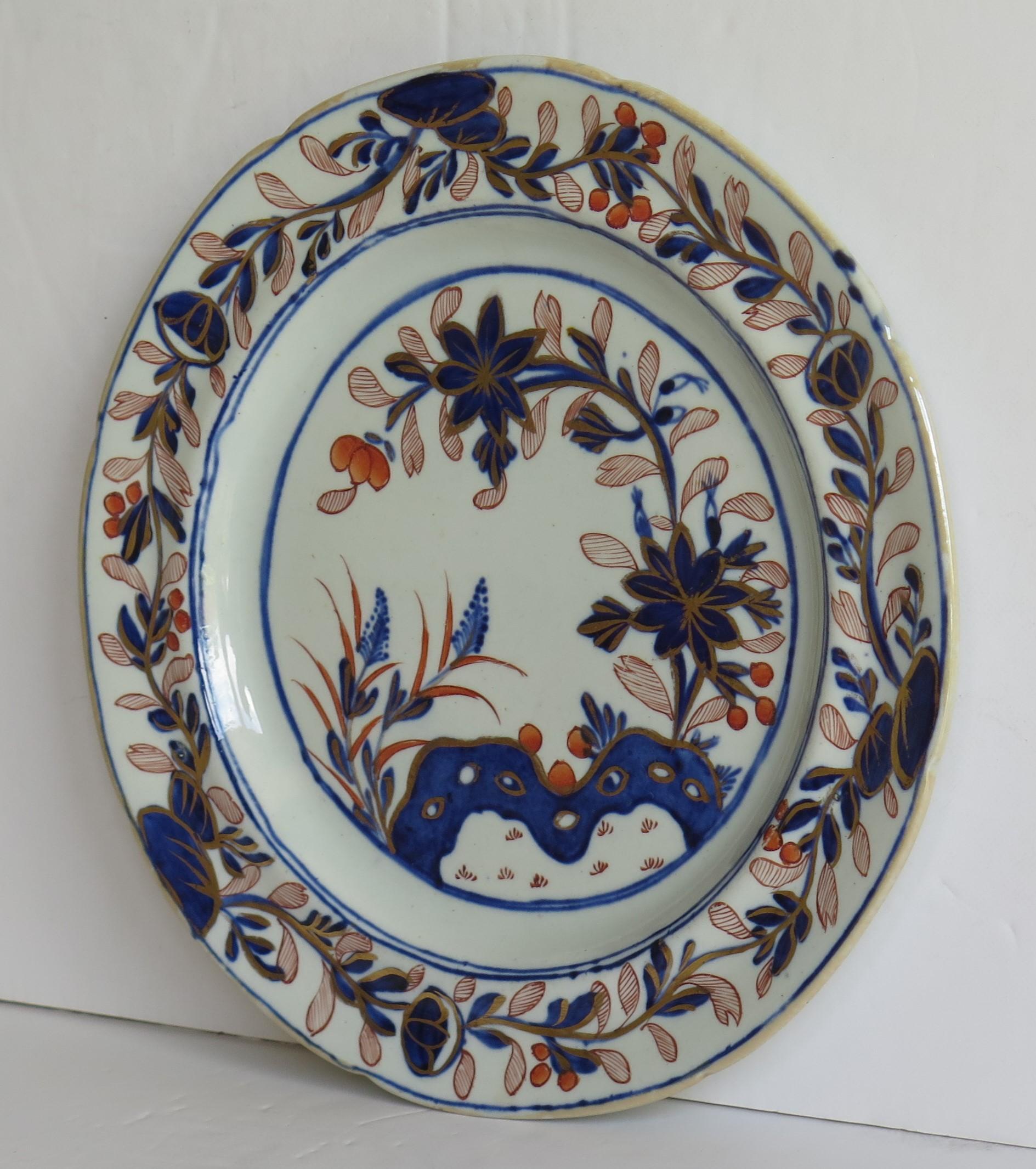 This is a fine Ironstone pottery side plate made by the Mason's factory at Lane Delph, Staffordshire, England and beautifully hand decorated in the Rock, Leaves and flowers Pattern, fully stamped and dating to the earliest period of Mason's