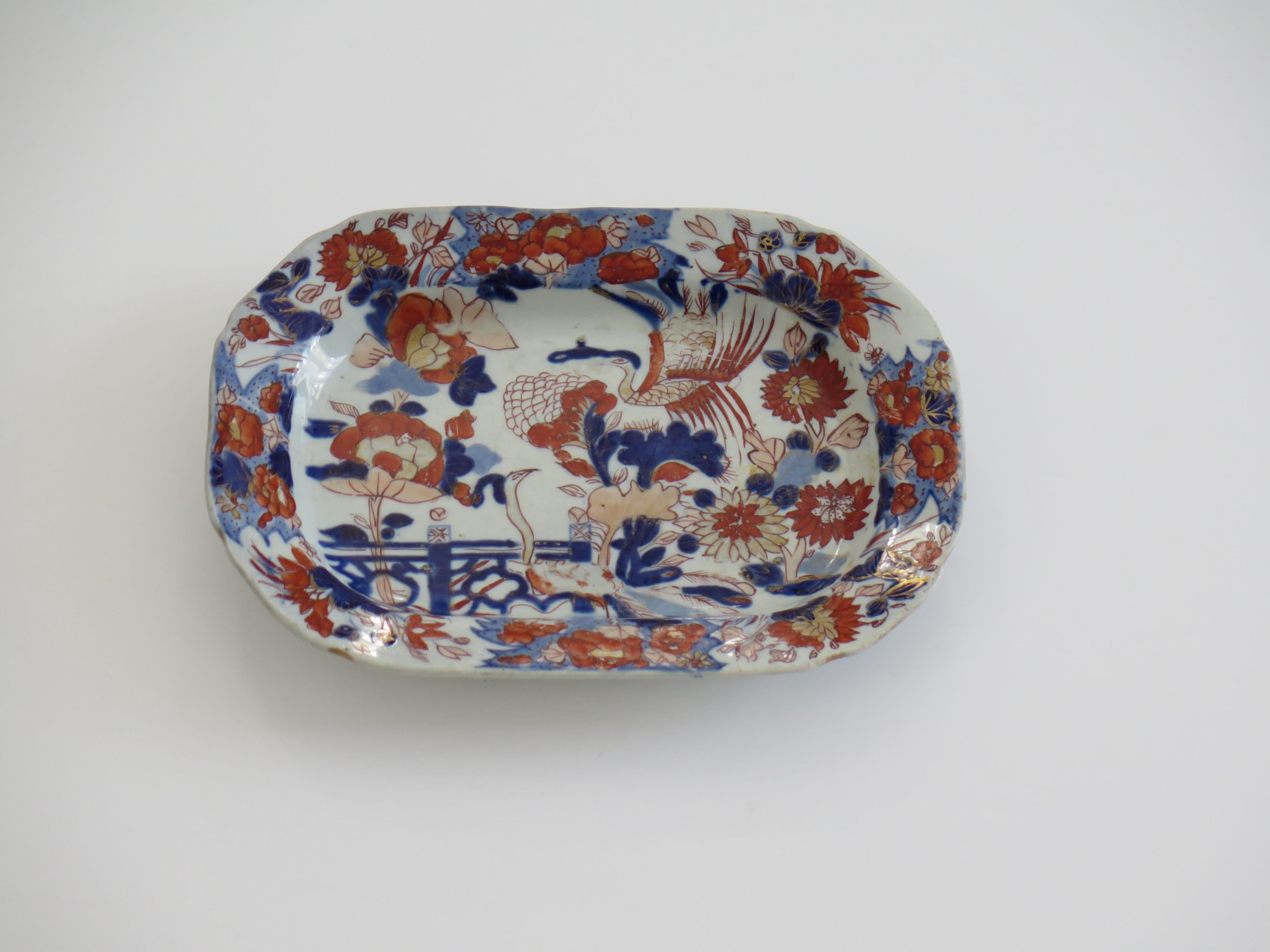 This is a very decorative  Mason's Ironstone pottery small dish or platter produced by the Mason's factory at Lane Delph, Staffordshire, England, circa 1815.

The dish or plate is rectangular in section with canted corners and a slightly notched rim