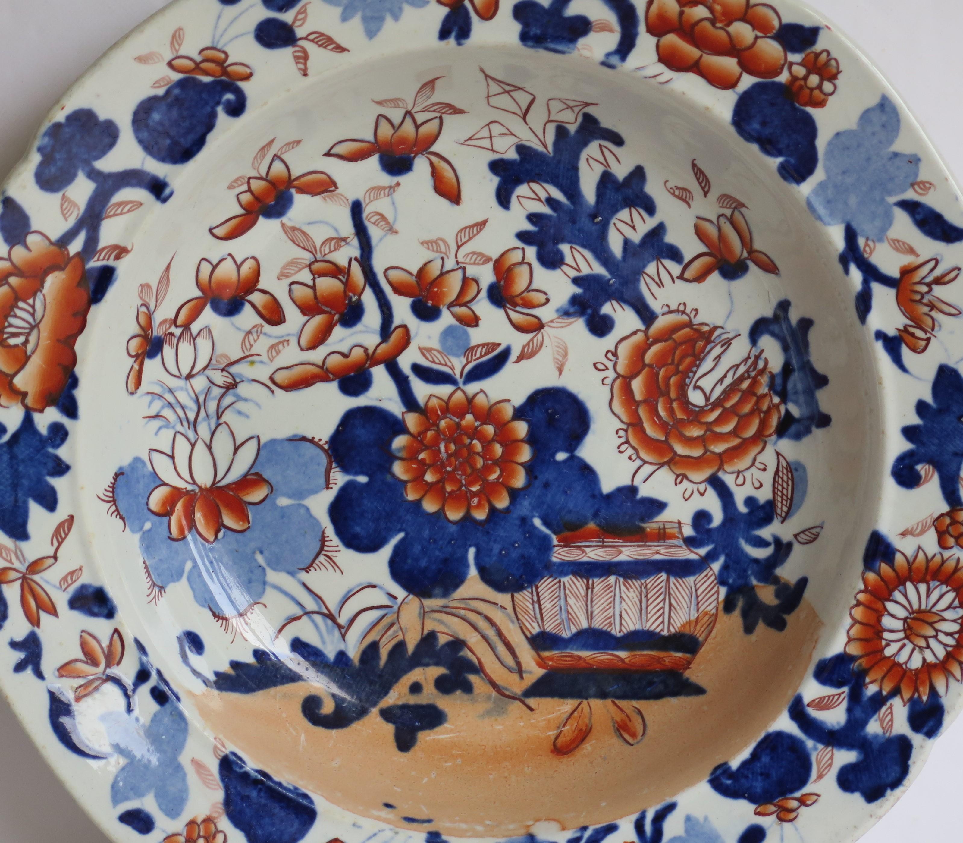 This is a very good early Mason's ironstone pottery soup bowl or deep plate hand painted in the very decorative Basket Japan pattern,  produced by the Mason's factory at Lane Delph, Staffordshire, England, circa 1813-1820.

The plate is circular