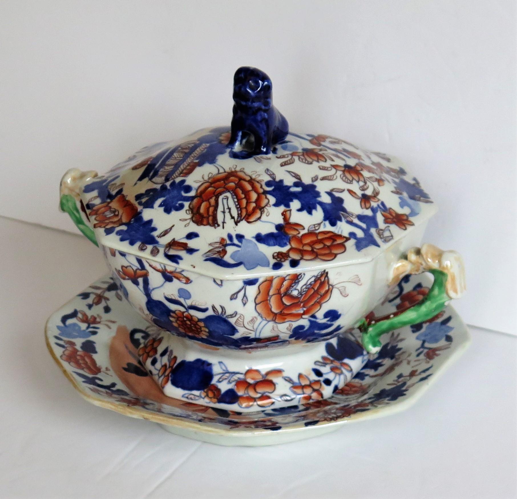 This is a very good ironstone tureen, complete with lid and base stand or plate, all in the Basket Japan pattern and made by Mason's of Lane Delph, Staffordshire, England, during the early part of the 19th century, circa 1820.

All pieces are well