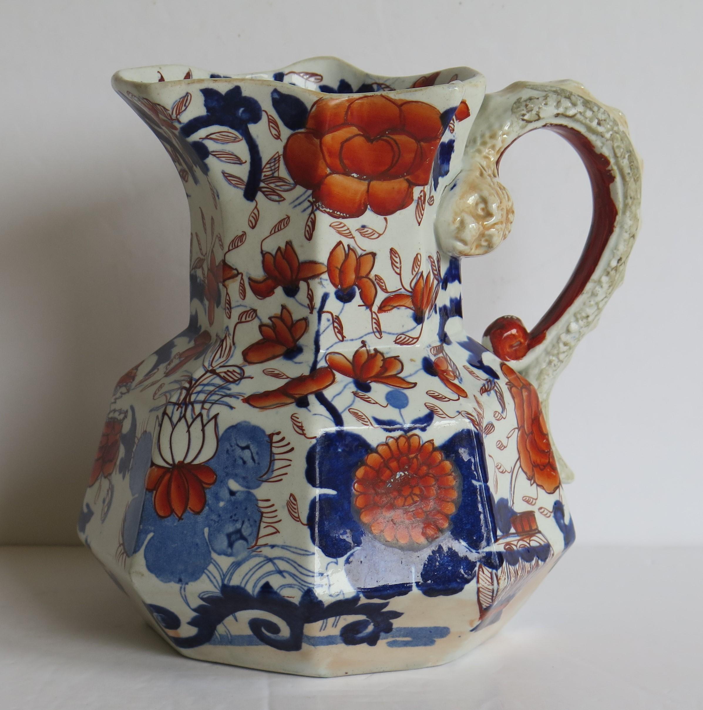 This is a good, early Mason's Ironstone large Hydra jug or pitcher in the Basket Japan pattern, made in the English, late Georgian period, circa 1815-1820.

The jug has the octagonal 